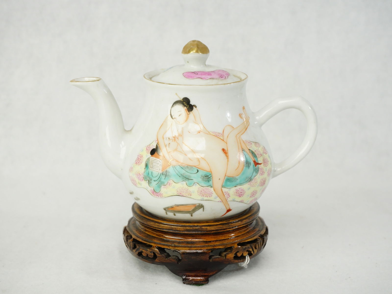 Chinese Famille-Rose 'Ferotic' Teapot with Wood Stand: Approximate size: 4x5.5x3.5 in Shipping: We offer in-house shipping services for most small items. This means that we will take care of packing and shipping the items directly to you. For larger or