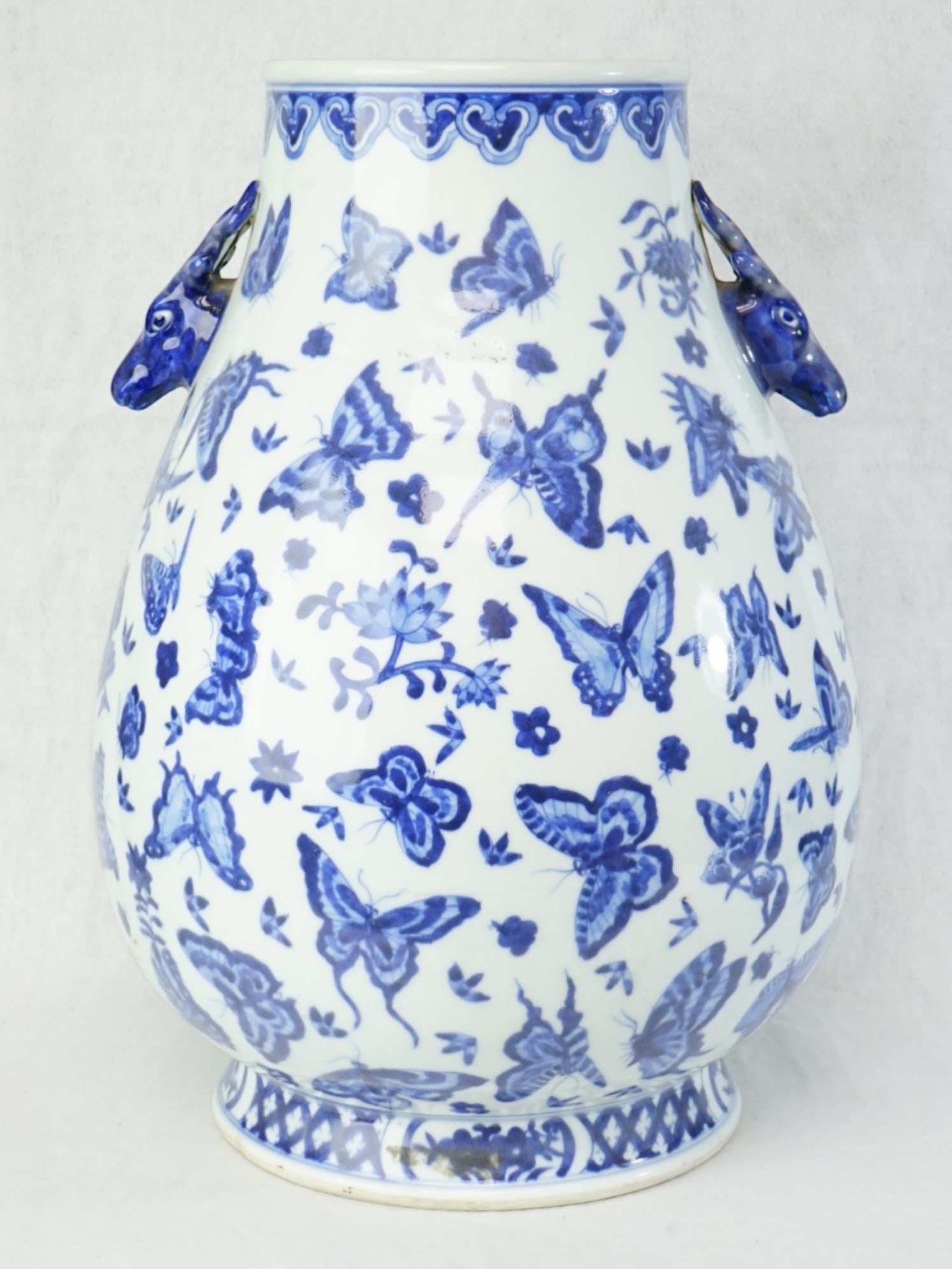 Chinese Blue and White ’Butterflies’ Deer Handle Zun Vase: Approximate size: H:17 in Shipping: We offer in-house shipping services for most small items. This means that we will take care of packing and shipping the items directly to you. For larger or