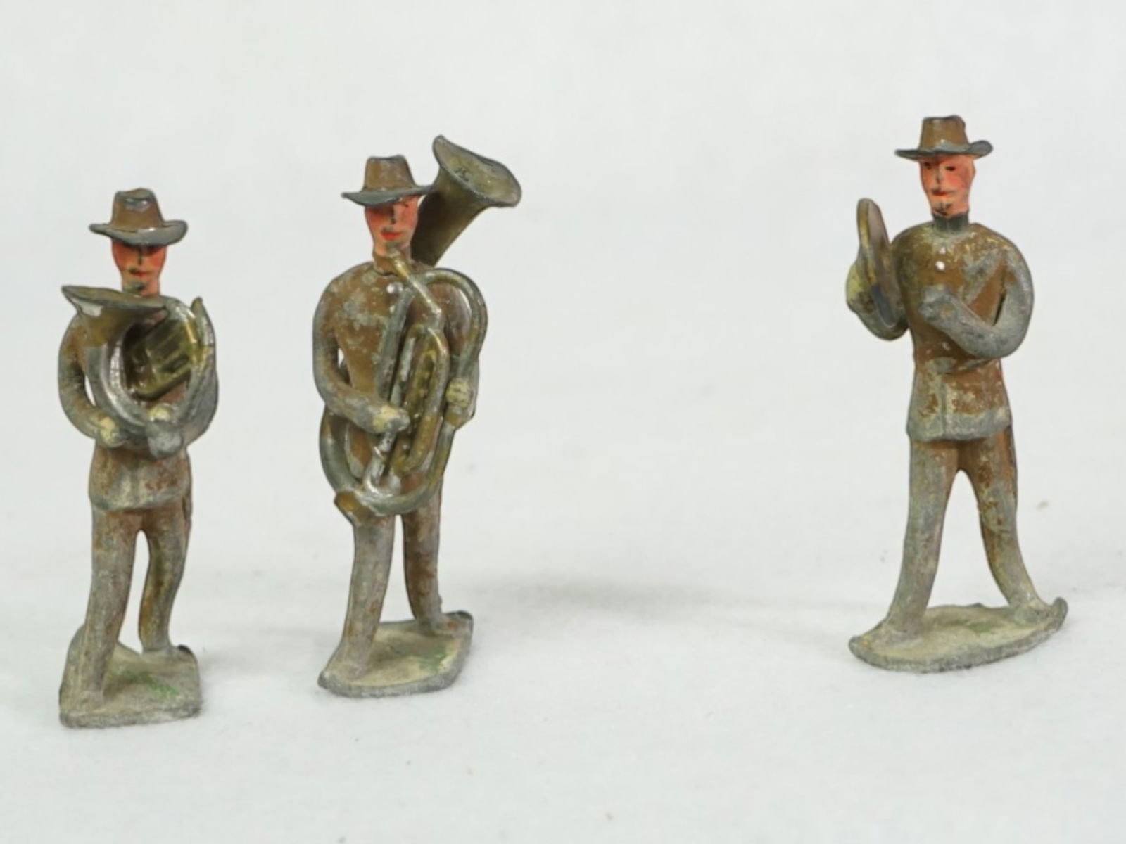 Three Miniature Lead Band Figures: Approximate size:H:2 in Shipping: We offer in-house shipping services for most small items. This means that we will take care of packing and shipping the items directly to you. For larger or
