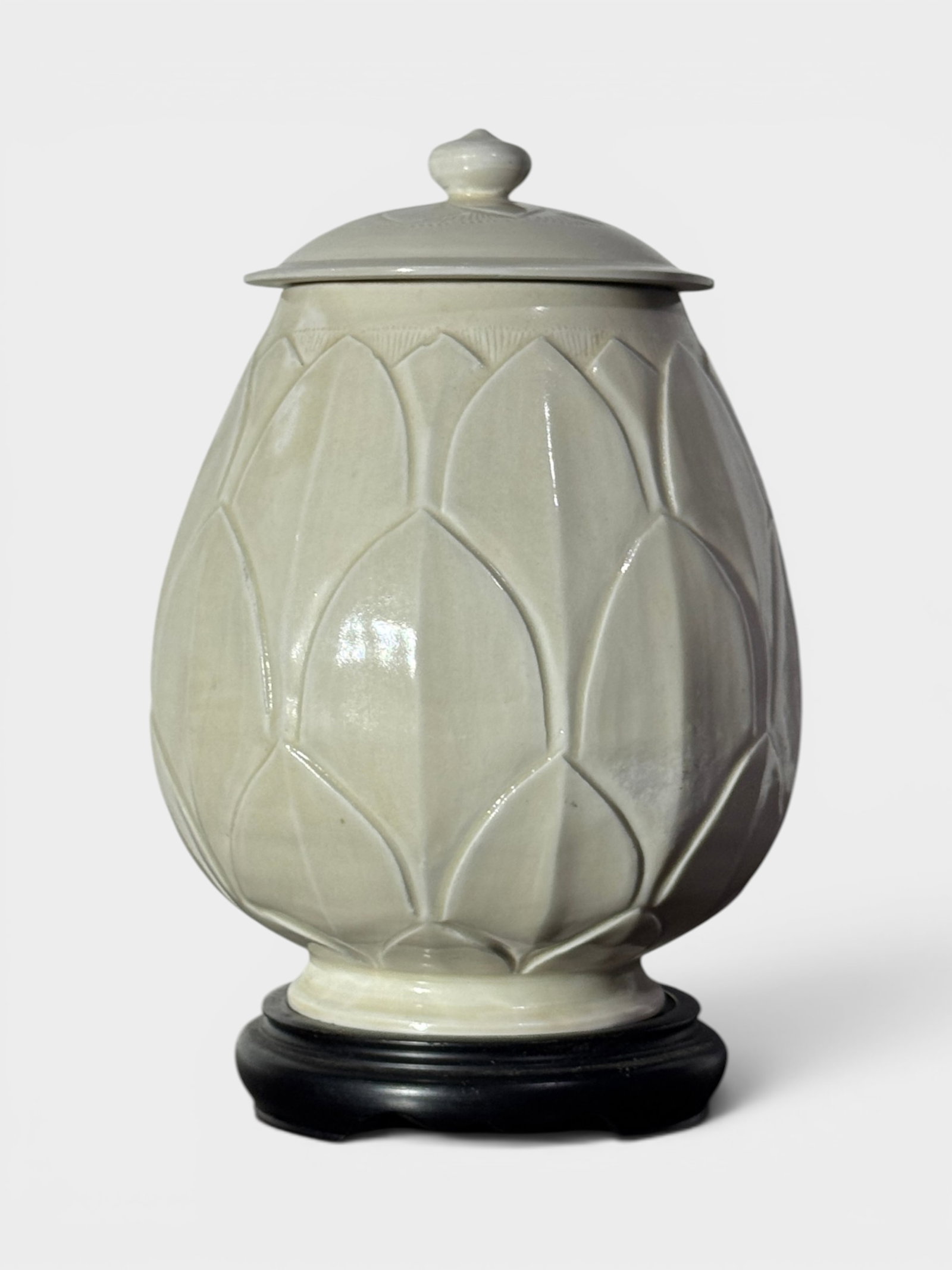 Chinese White Porcelain Lotus Vase: Chinese white glazed covered vase with lotus pedalmotif, sit on hardwood base, vase 7.5"ht Shipping: We offer in-house shipping services for most small items. This means that we will take care of pack