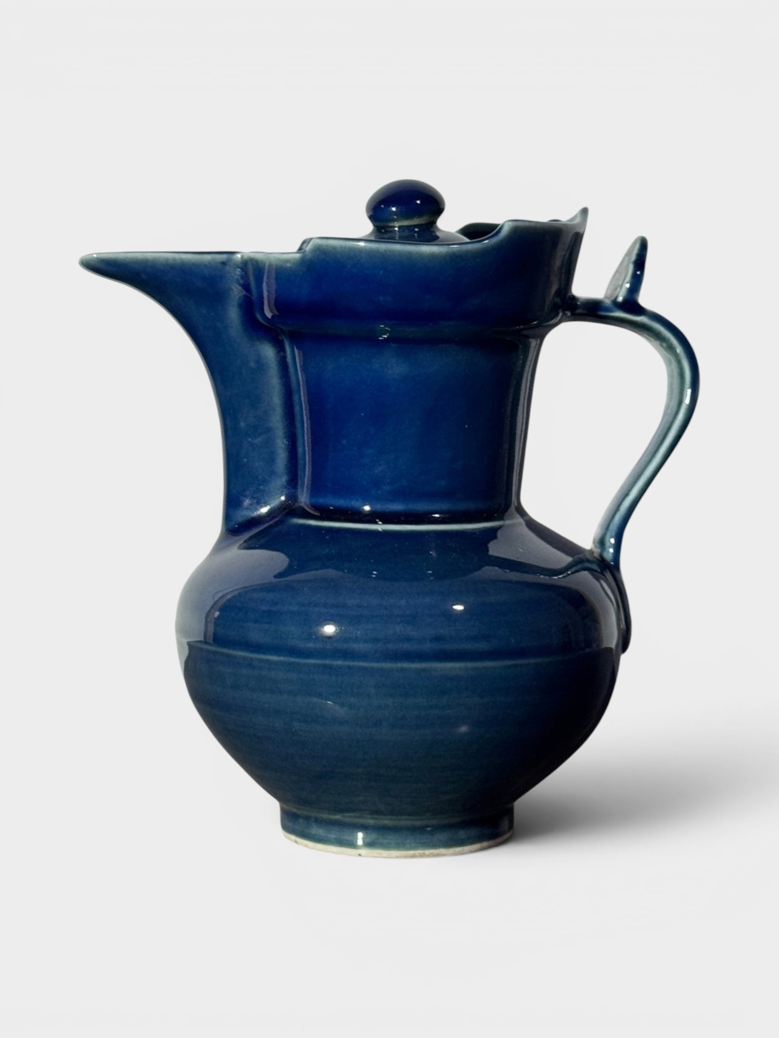 Chinese Blue Monochrome Porcelain Monk Pitcher: Chinese blue galzed monochrome porcelain monk picther, 8"ht 7.5"w Shipping: We offer in-house shipping services for most small items. This means that we will take care of packing and shipping the item