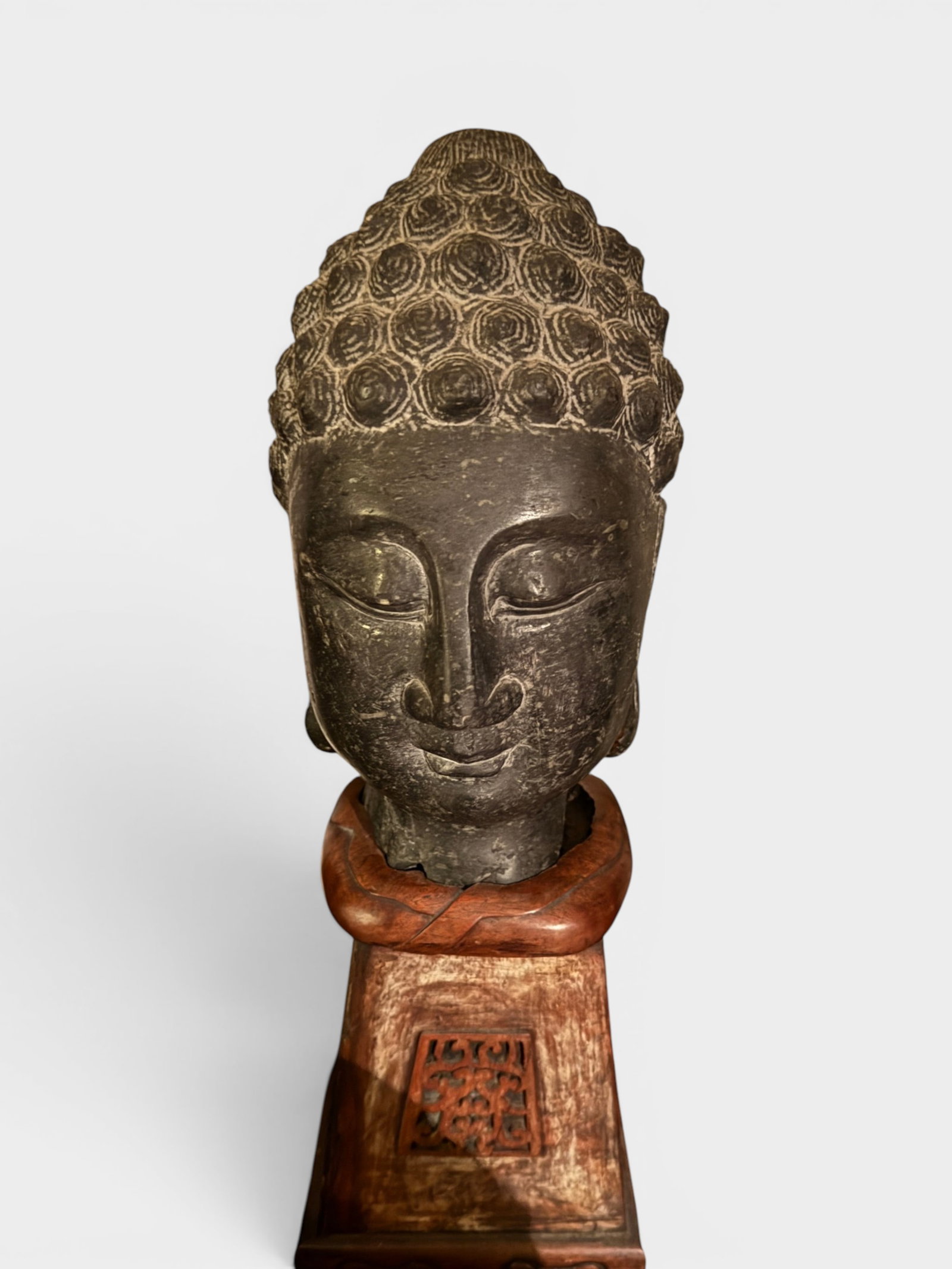 Chinese Black Stone Buddha Head on Stand, Ming Dynasty or Earlier: Chinese black stone buddha head on wood stand, ming dynasty or earlier, very heavy Shipping: We offer in-house shipping services for most small items. This means that we will take care of packing and 