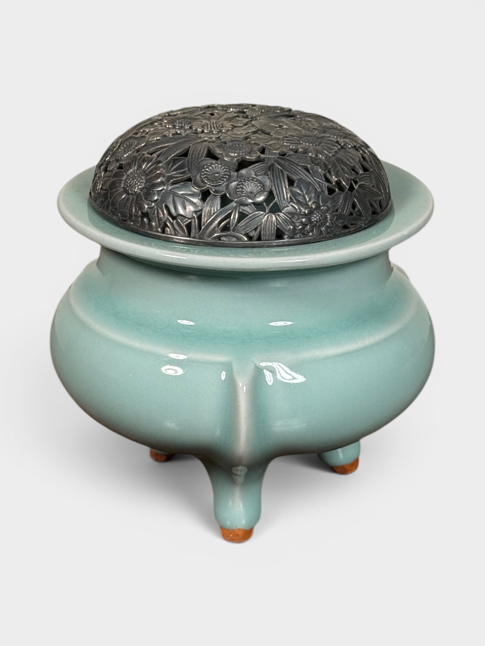 Japanese Celadon Porcelain Censer with Silver Lid: Japanese studio porcelain censer of celadon glaze, silver lid, impressed mark shuzhan, 4.5"dia 4.25"ht Shipping: We offer in-house shipping services for most small items. This means that we will take 