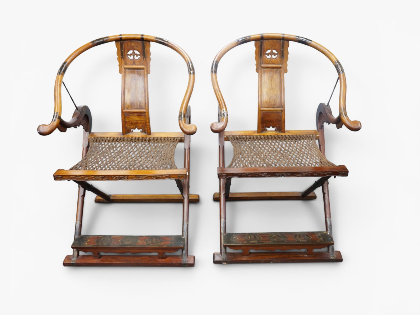 Pair of Chinese Hardwood Folding Chairs: Approximate size: 40x26x22 in Shipping: We offer in-house shipping services for most small items. This means that we will take care of packing and shipping the items directly to you. For larger or spe