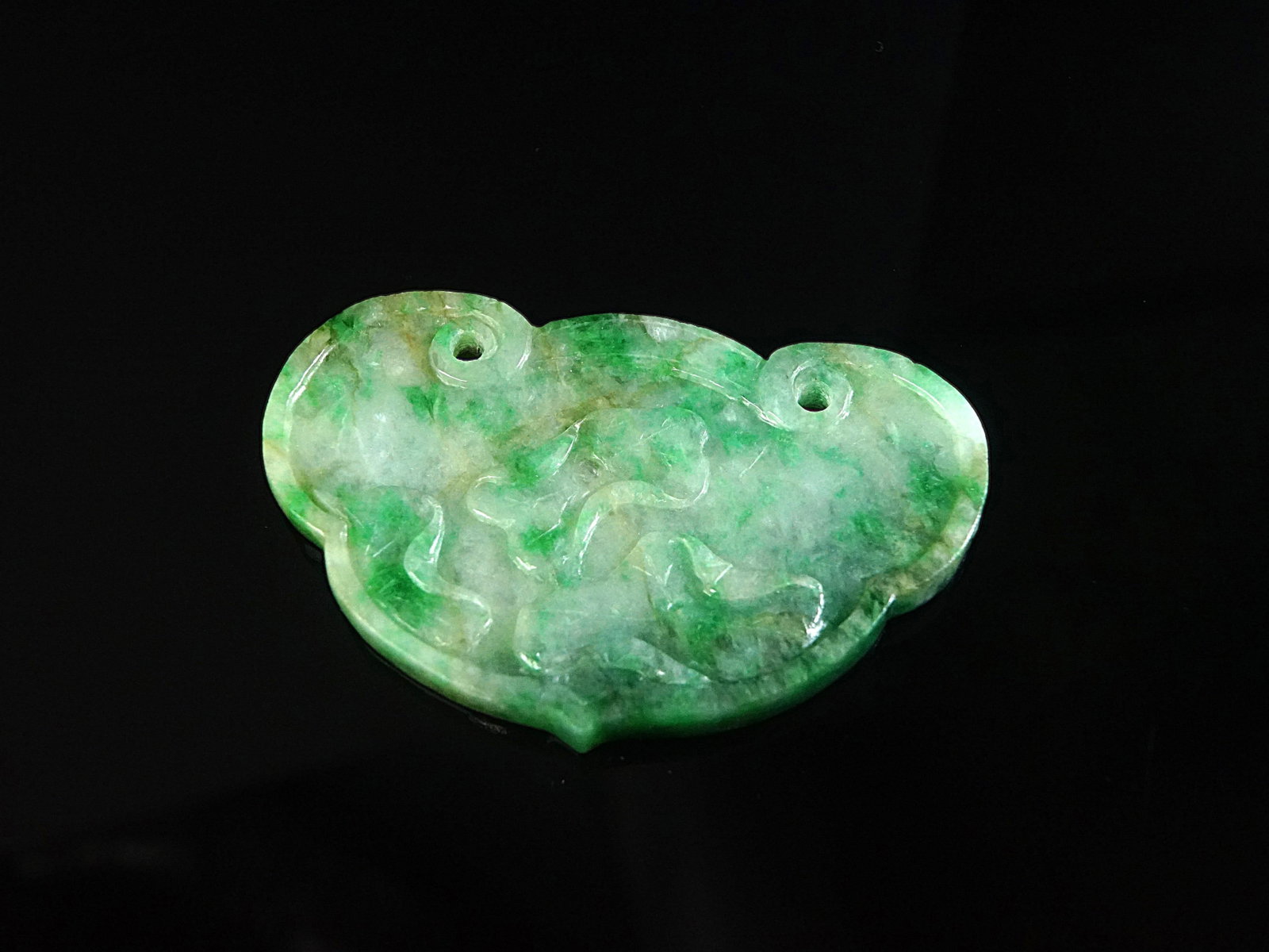 Chinese Carved Jadeite Lock-Form Pendant: Approximate size: 2 5/8x2 in Shipping: We offer in-house shipping services for most small items. This means that we will take care of packing and shipping the items directly to you. For larger or spec