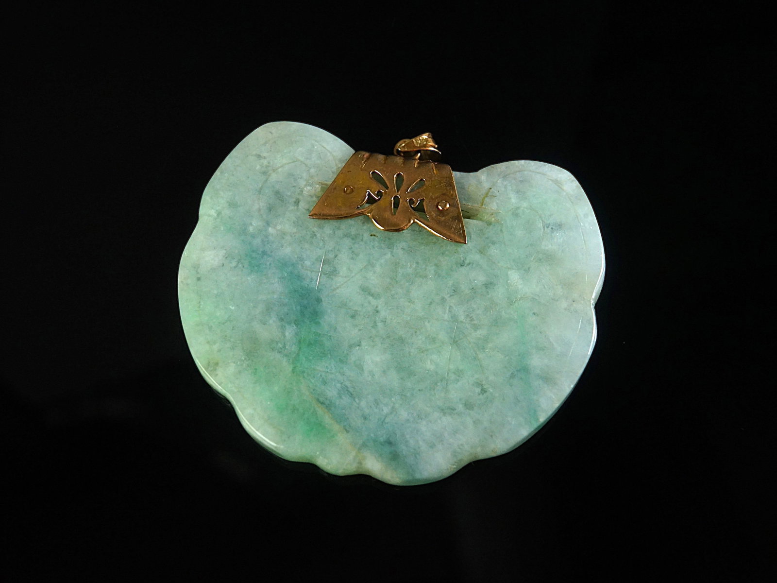 A Chinese Carved Jadeite Pendant with 18K Gold Fitting: Approximate size: largest pendant 2 3/8x2 in,overall weight 218.55 ct. Shipping: We offer in-house shipping services for most small items. This means that we will take care of packing and shipping the