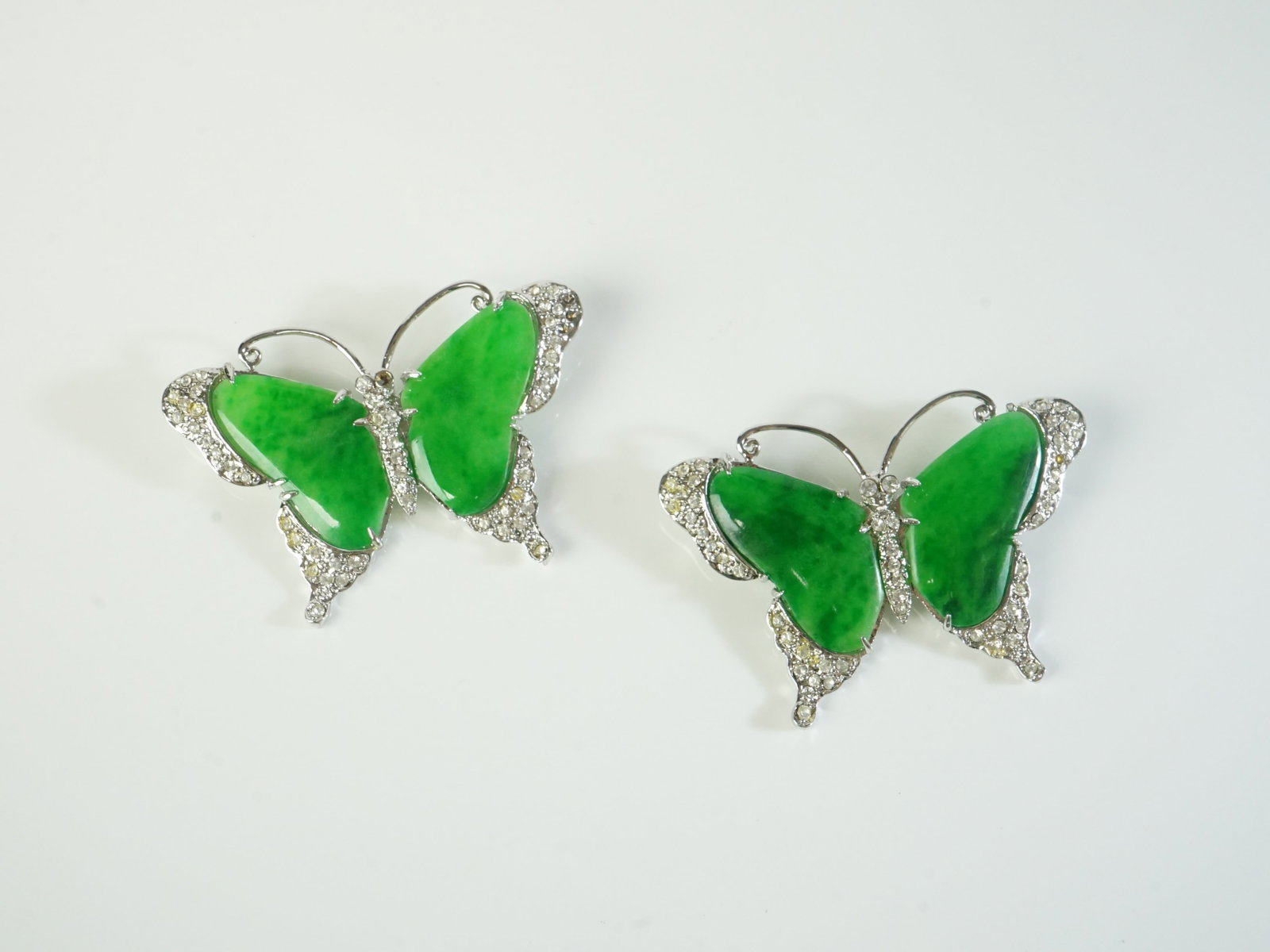 Pair of Chinese Jadeite Butterfly Brooches: Approximate size: 2.5x1.75 in (each) Shipping: We offer in-house shipping services for most small items. This means that we will take care of packing and shipping the items directly to you. For larger