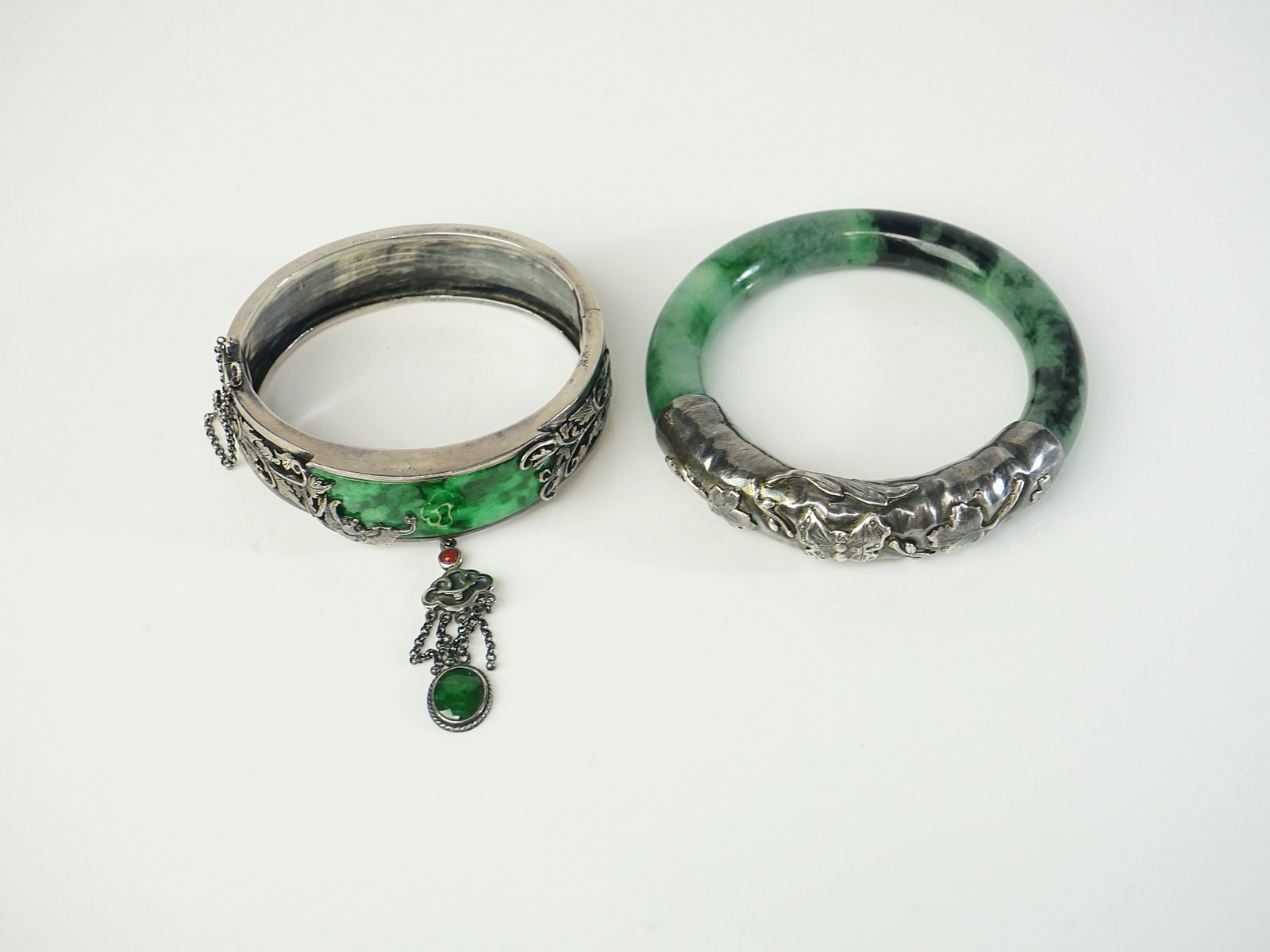 Two Chinese Jade Bangle with Sterling Silver Mounts: Approximate size: inner dia 58mm/62mm ,overall weight 5.42 ozt Shipping: We offer in-house shipping services for most small items. This means that we will take care of packing and shipping the items d