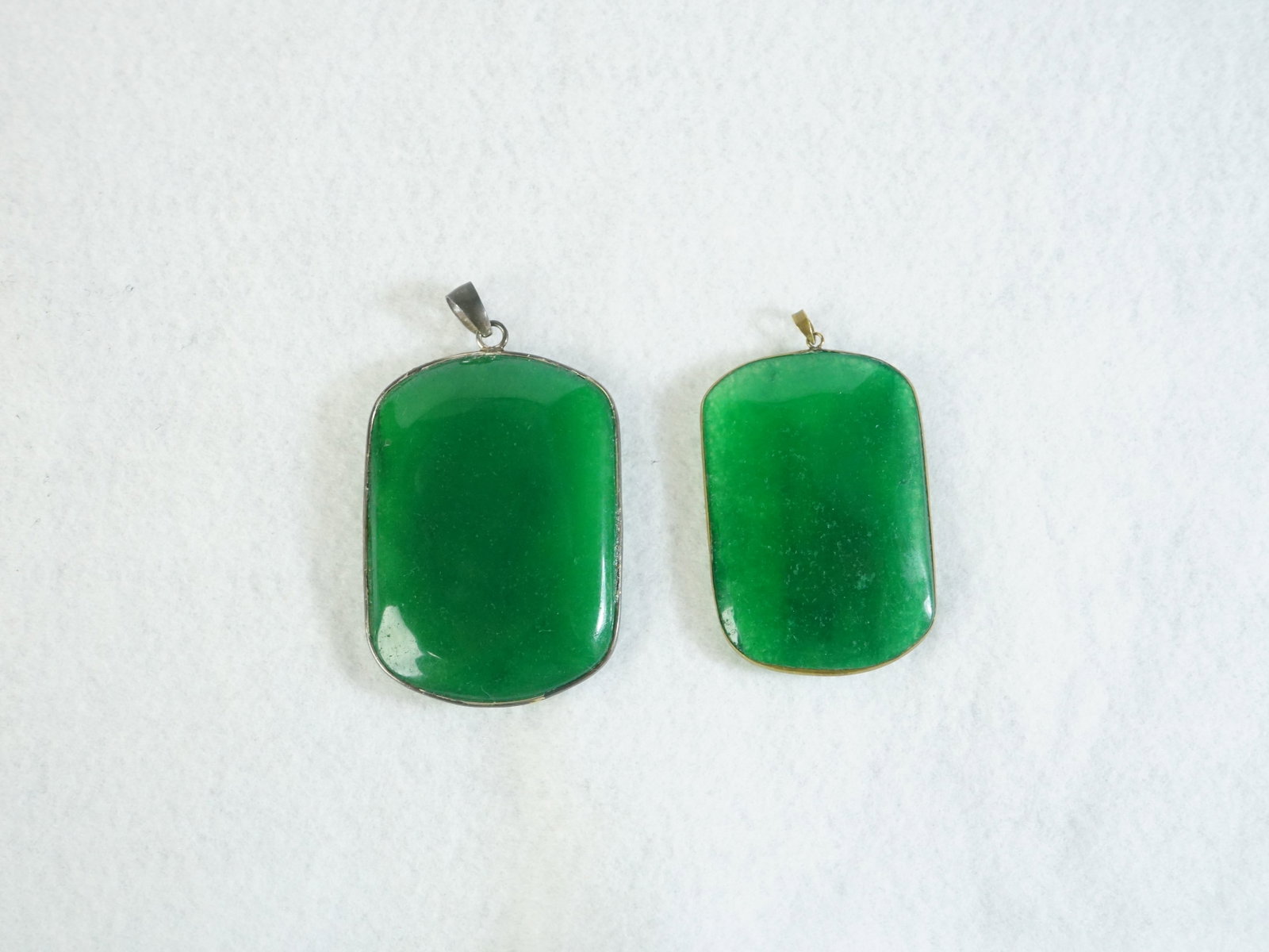 Two Chinese Jadeite Pendants: Approximate size: in Shipping: We offer in-house shipping services for most small items. This means that we will take care of packing and shipping the items directly to you. For larger or specialized 