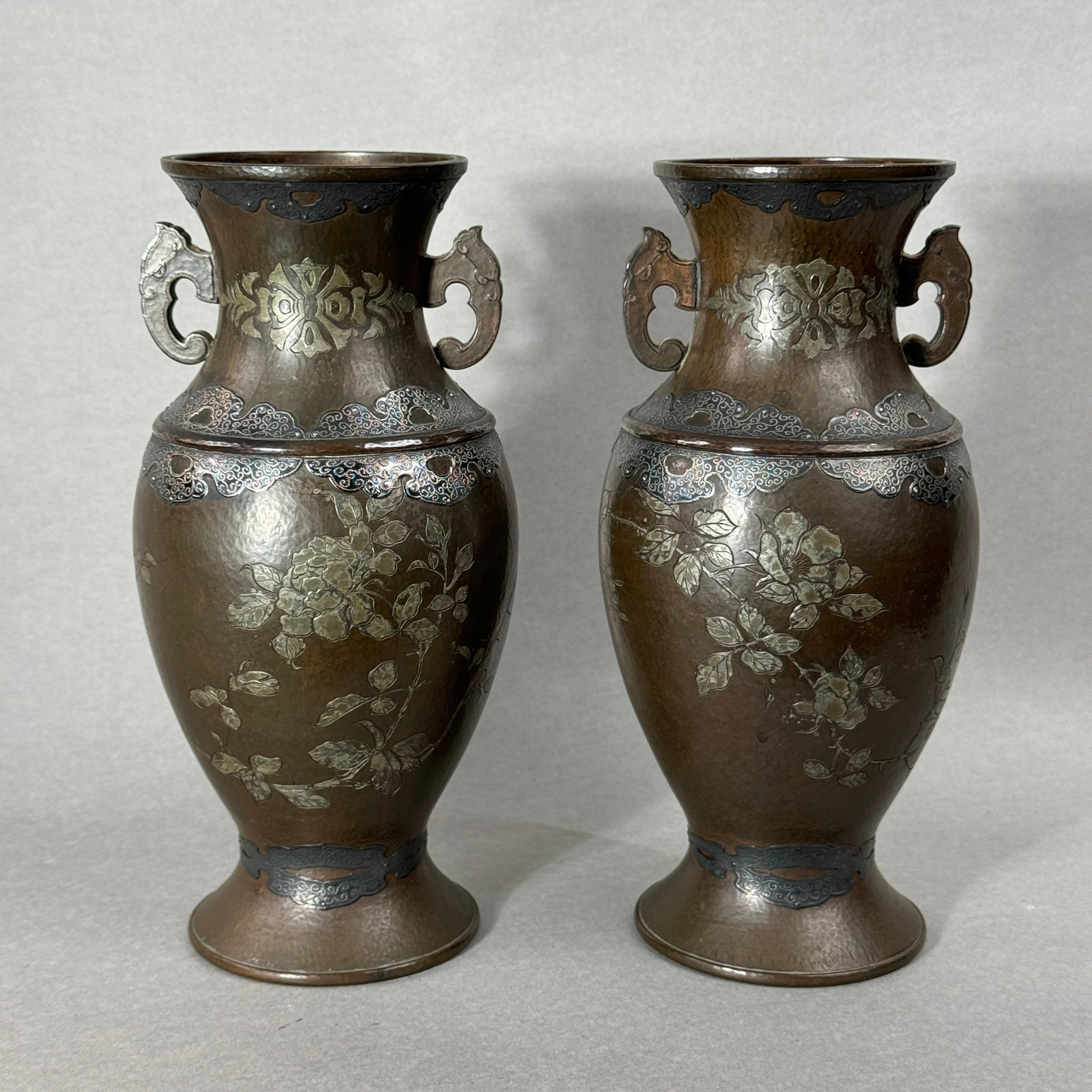 Pair Japanese Copper Repousse Vases with Silver Applications: meiji period, copper repousse with silver applied borders at rim and shoulders, peony scene, 9.75"ht Shipping: We offer in-house shipping services for most small items. This means that we will take ca