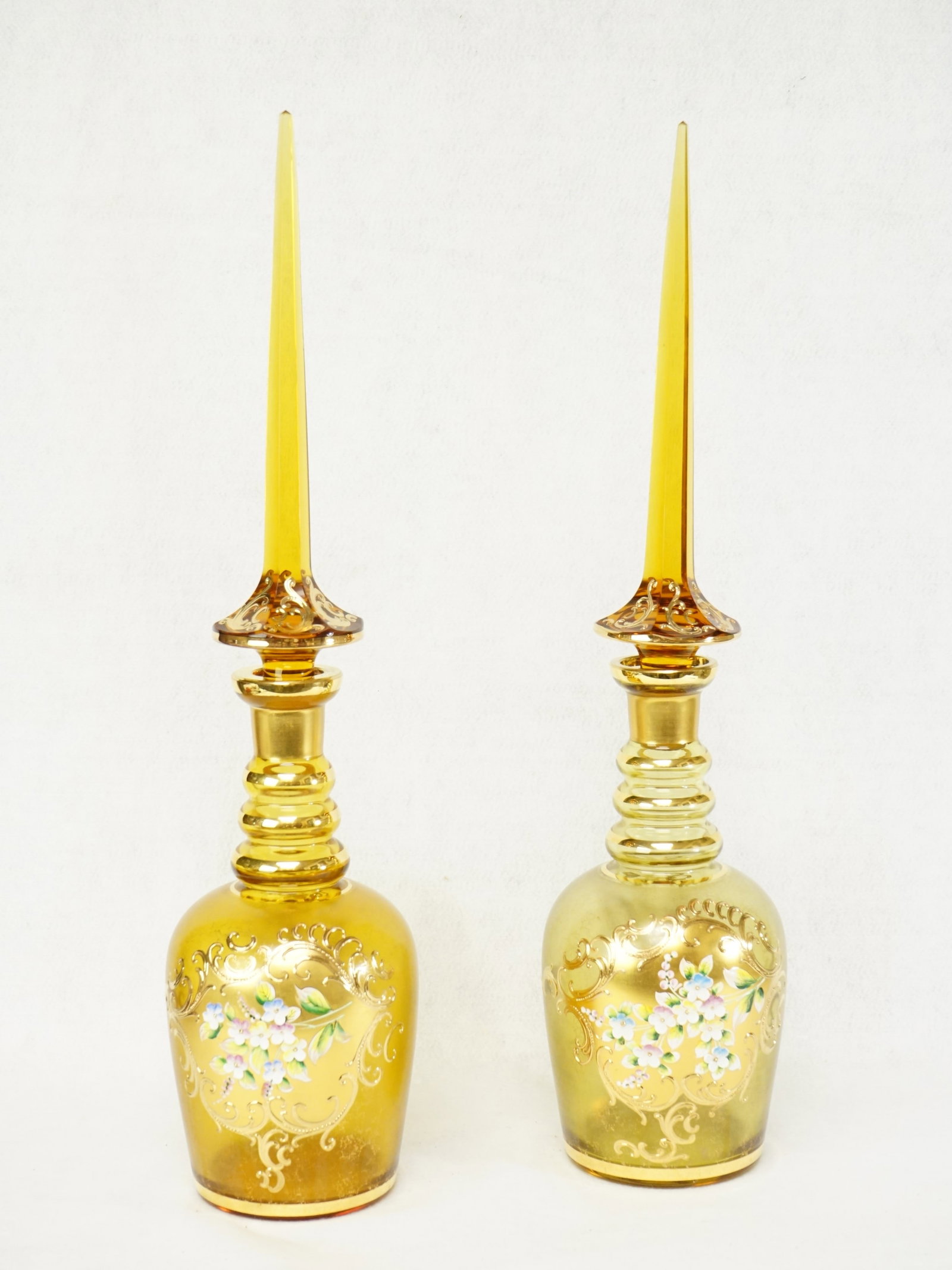 Pair of Bohemian Parcel-Gilt and Polychrome-Painted Glass Decanters: Approximate size: H:20.25 in Shipping: We offer in-house shipping services for most small items. This means that we will take care of packing and shipping the items directly to you. For larger or spec
