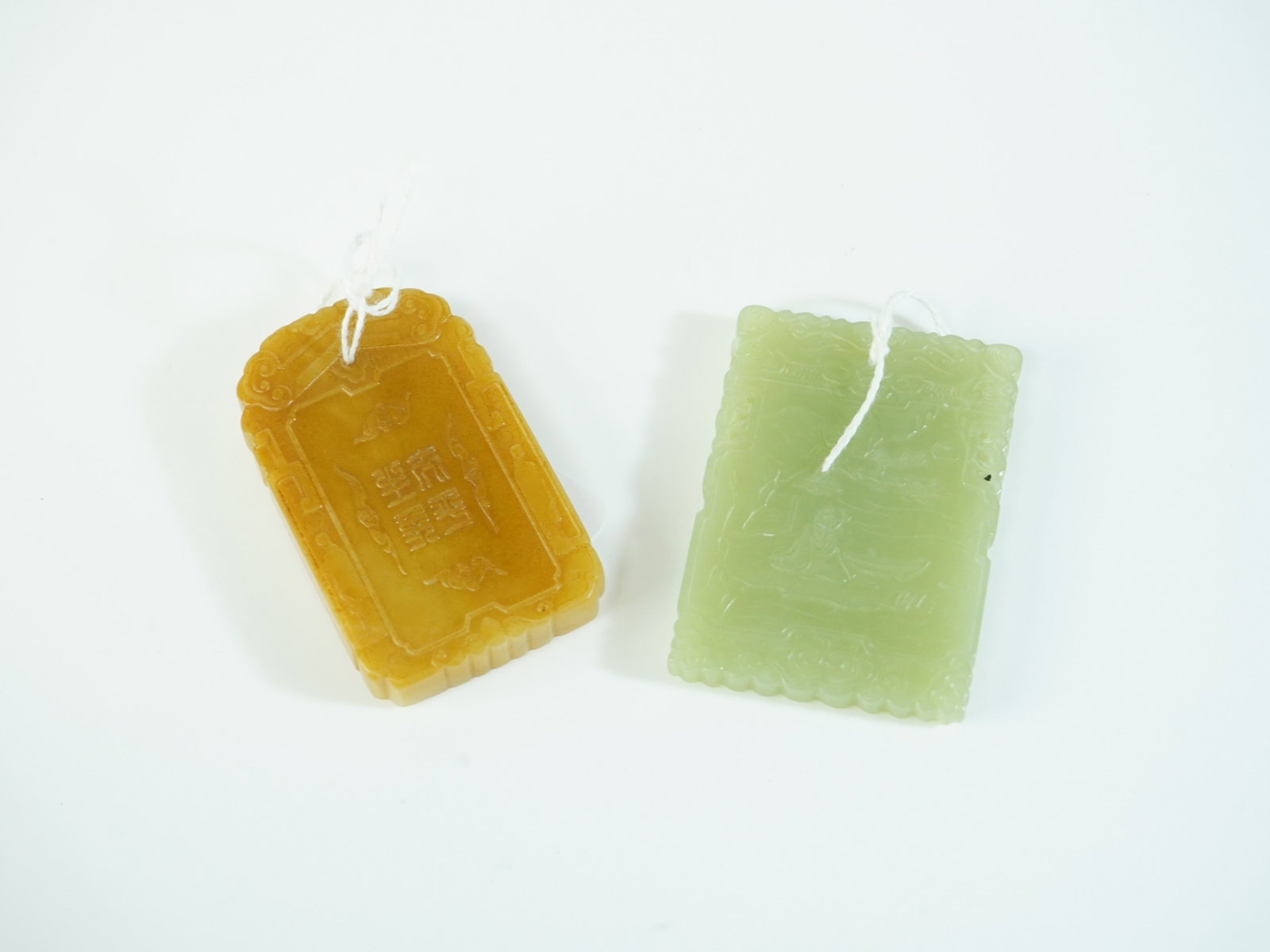 Lot of Two Chinese Carved Jade Plaque Pendants: Approximate size: 2 3/8x1 3/4 in,2 1/2x1 1/2 in Shipping: We offer in-house shipping services for most small items. This means that we will take care of packing and shipping the items directly to you.
