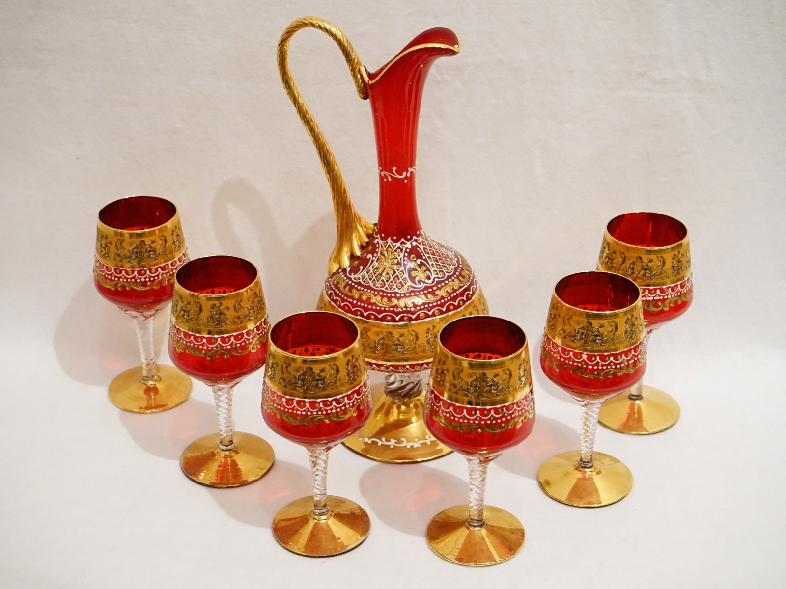 Murano Venetian Wine Decanter Set of 7- Ruby with 24K Heavy Gold Gilded -1900's: Approximate size: decanter 13x5x6.5 in Shipping: We offer in-house shipping services for most small items. This means that we will take care of packing and shipping the items directly to you. For larg