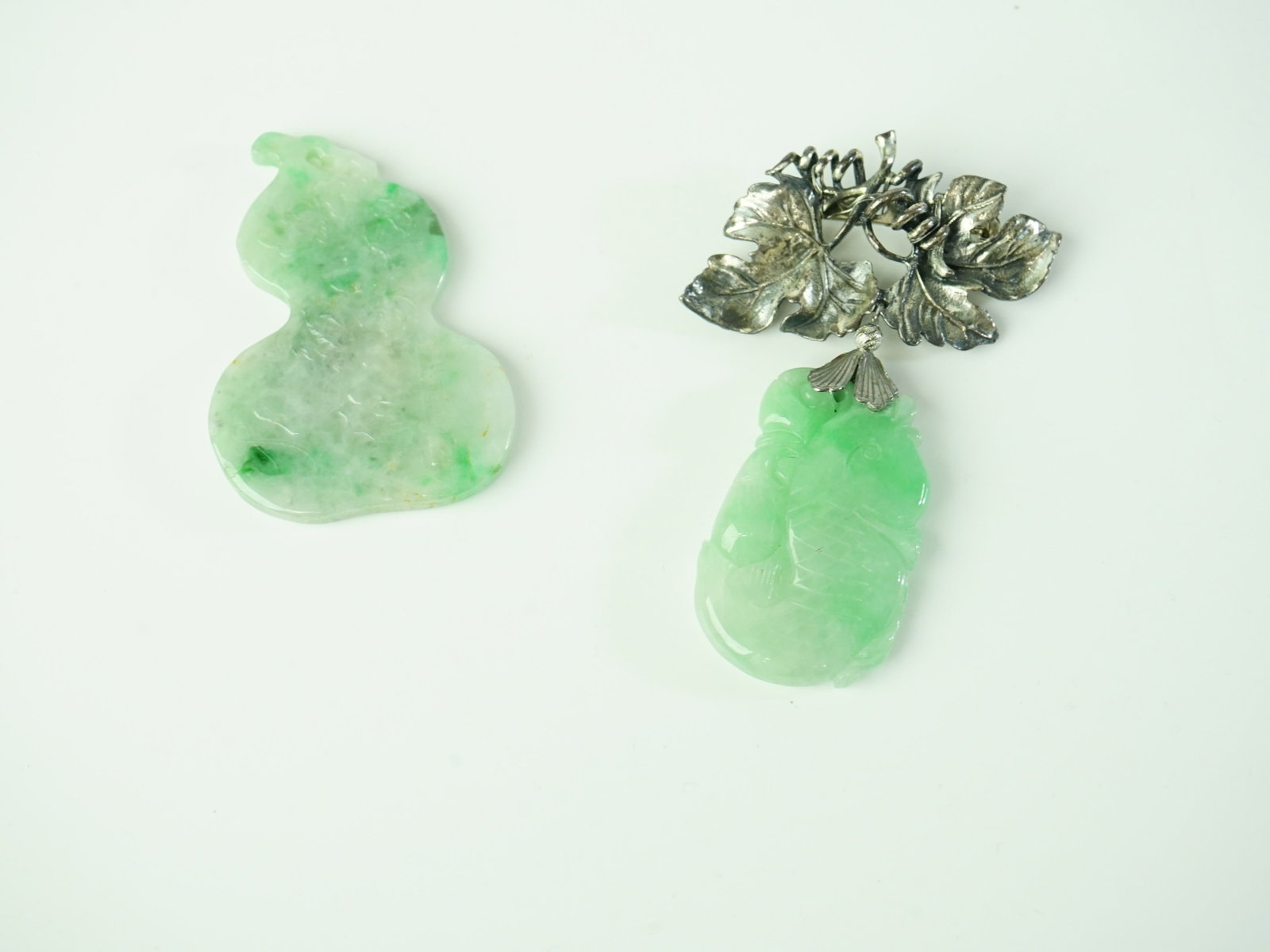 Two Chinese Carved Jadeite Pendants: Approximate size: 2.25x1.5 in /3.25x2 in Shipping: We offer in-house shipping services for most small items. This means that we will take care of packing and shipping the items directly to you. For