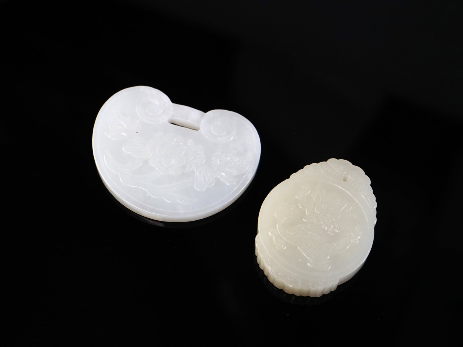 A Chinese Carved Jade Lock-Form Pendant and a Plaque Pendant: Approximate size: 2 1/8x1 1/8x3/8 in,lock 2.5x2x0.25 in Shipping: We offer in-house shipping services for most small items. This means that we will take care of packing and shipping the items