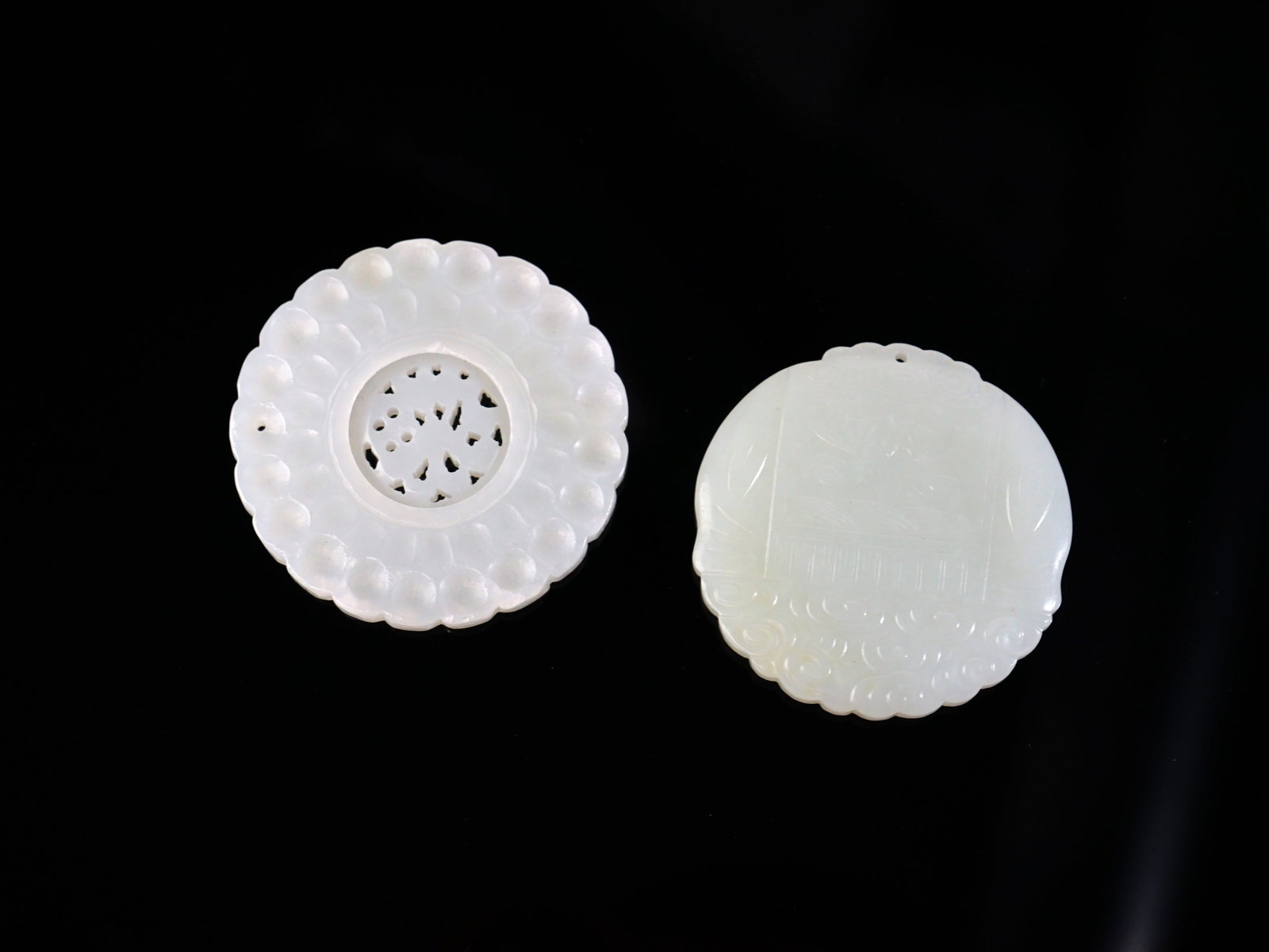 Two Chinese Carved Round Jade Pendants: Approximate size: dia 2 in Shipping: We offer in-house shipping services for most small items. This means that we will take care of packing and shipping the items directly to you. For larger or