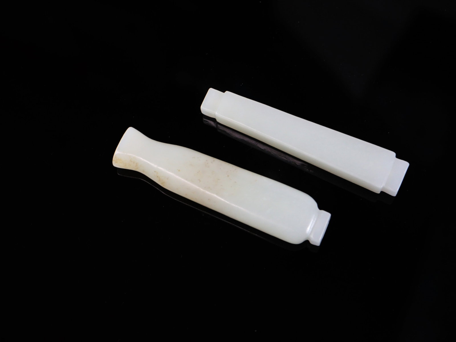Two Chinese Carved White Jade Tubes: Approximate size:L 3 in Shipping: We offer in-house shipping services for most small items. This means that we will take care of packing and shipping the items directly to you. For larger or specializ
