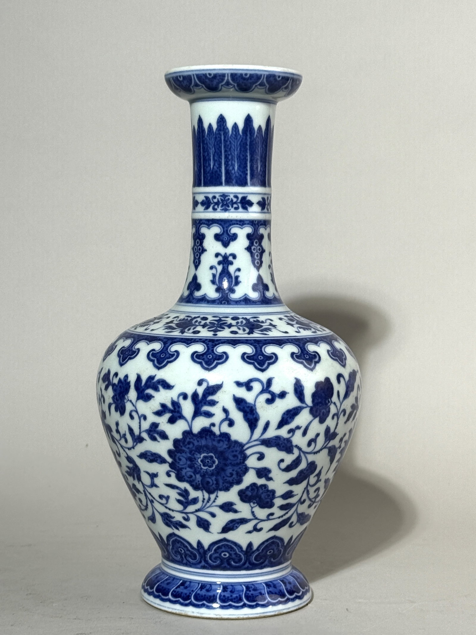 A Chinese Blue and White 'Lotus Scroll' Vase: 10.75"ht, lotus vine motif, sic character mark Shipping: We offer in-house shipping services for most small items. This means that we will take care of packing and shipping the items directly to you. 