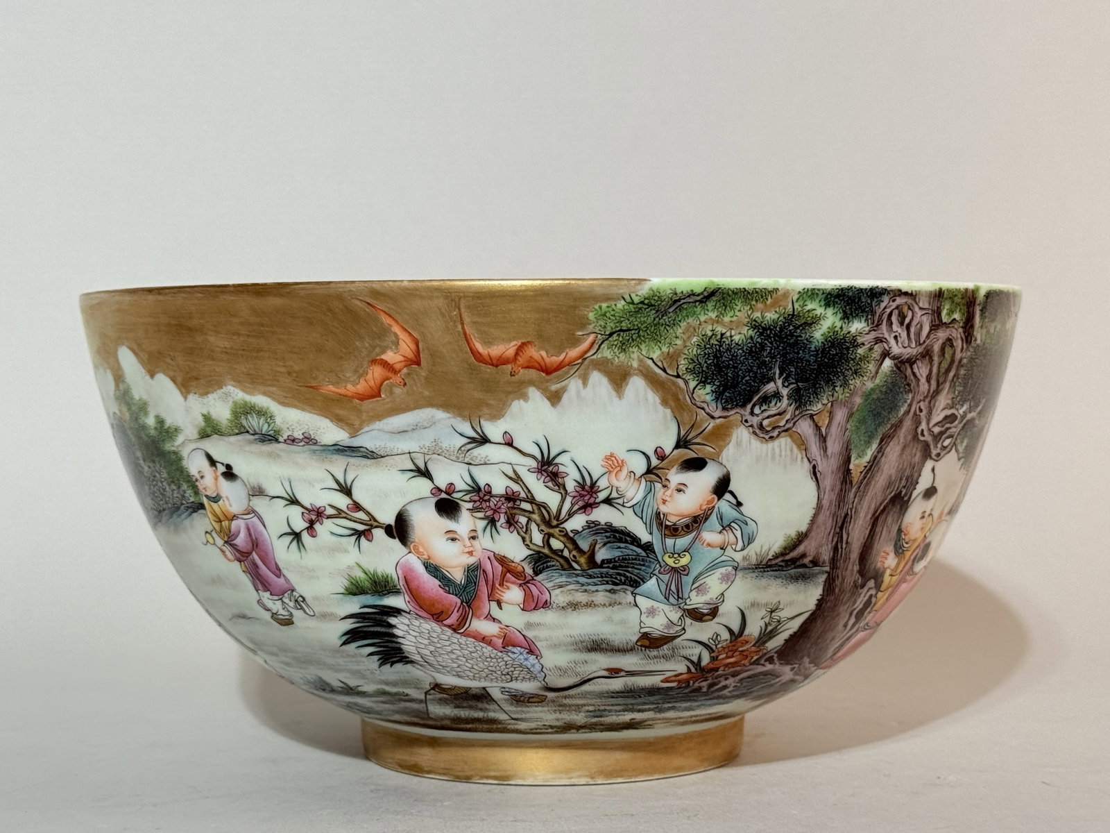 A Chinese Famille-Rose 'Boys at Play' Bowl: 9.6"dia 4.75"ht, gilt enamled ground with children playing scene Shipping: We offer in-house shipping services for most small items. This means that we will take care of packing and shipping the items