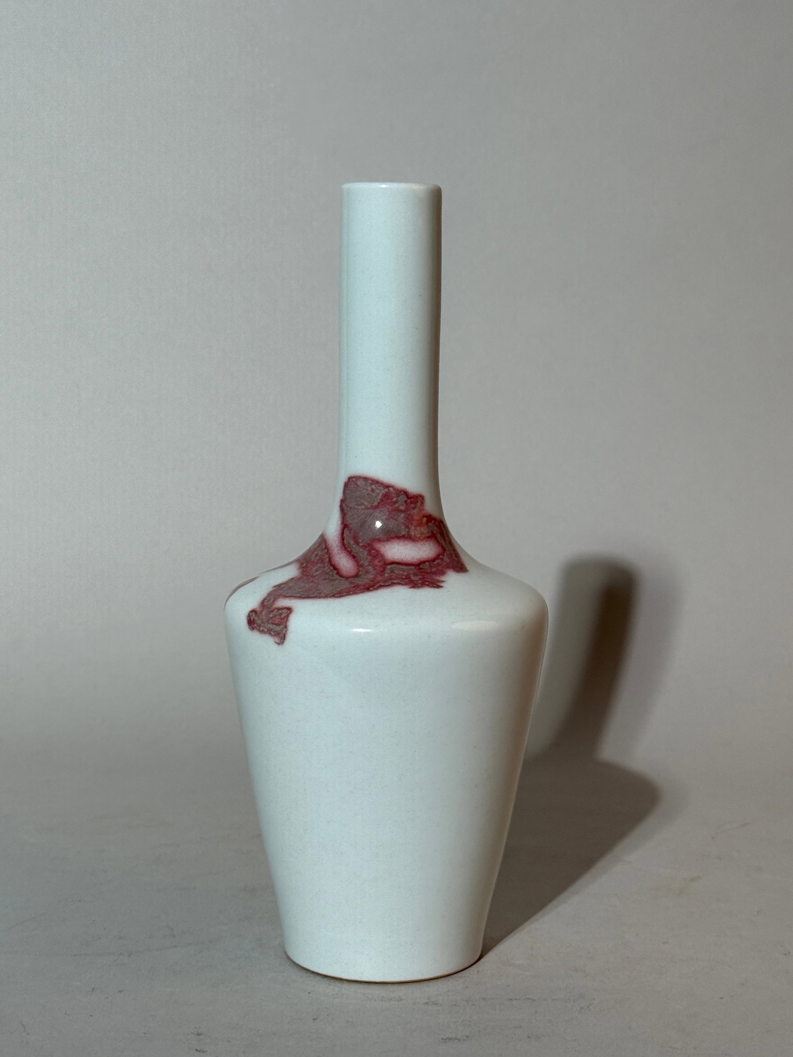 A Chinese Underglaze Copper-Red 'Dragon' Vase: 8.25"ht Shipping: We offer in-house shipping services for most small items. This means that we will take care of packing and shipping the items directly to you. For larger or specialized items, we rec