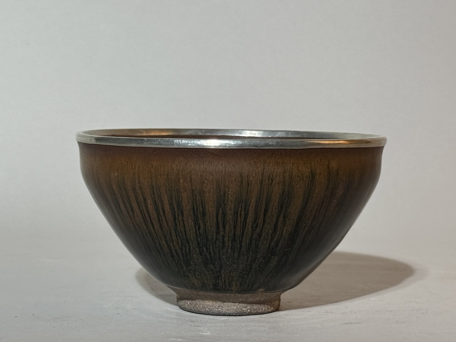 A Chinese 'Hare's-Fur' Glazed Tea Bowl: 5"dia 2.75"ht Shipping: We offer in-house shipping services for most small items. This means that we will take care of packing and shipping the items directly to you. For larger or specialized items,