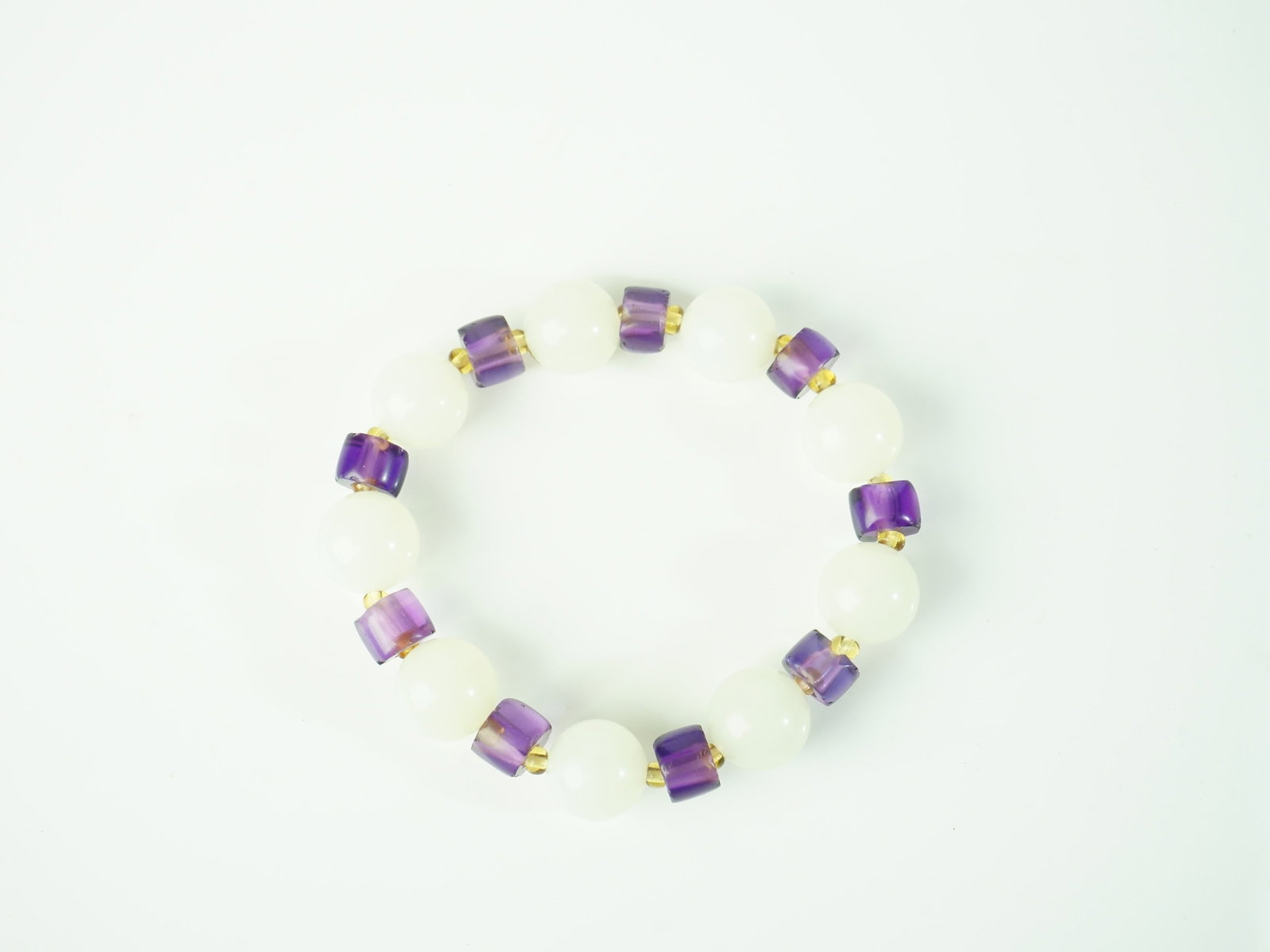 White Jade and Amethyst Bead Bracelet: Approximate size: bead dia 5/8 in Shipping: We offer in-house shipping services for most small items. This means that we will take care of packing and shipping the items directly to you. For larger