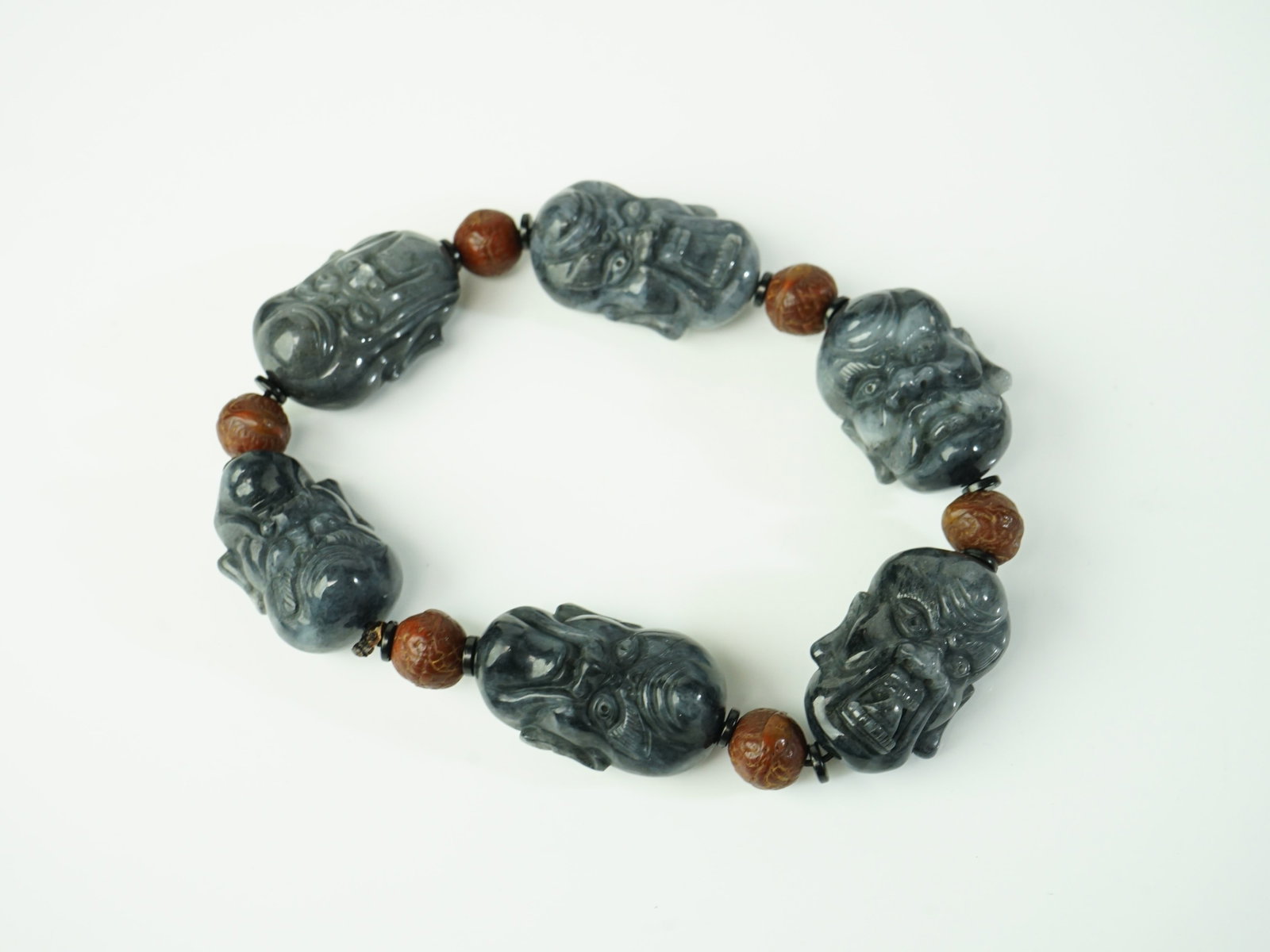 Chinese Carved Black Jade 'Luohan' Bead Bracelet: Approximate size: large bead 2x1.25x1 in Shipping: We offer in-house shipping services for most small items. This means that we will take care of packing and shipping the items directly to you. For la