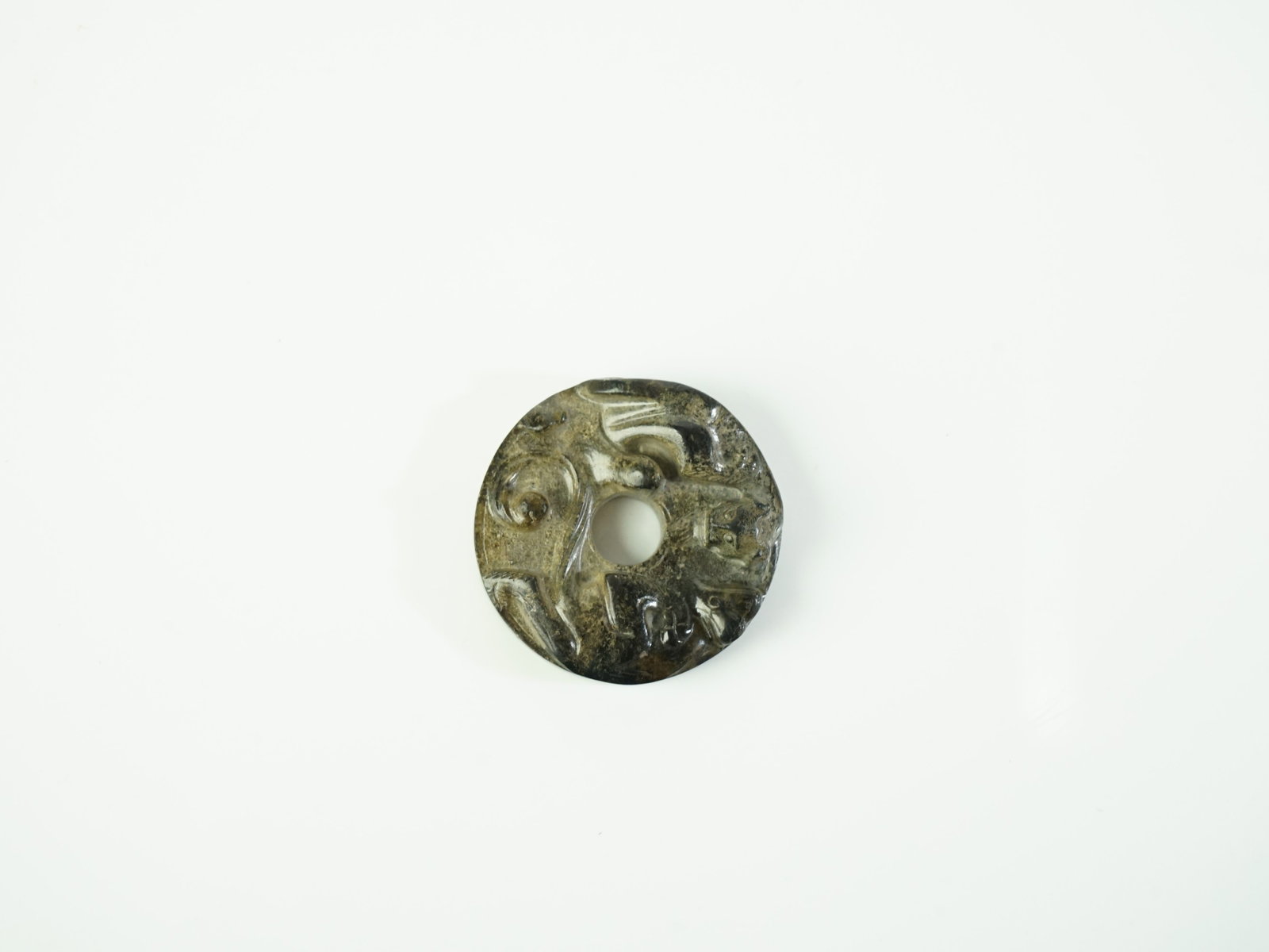 Chinese Dark Jade Bi Disc: Approximate size: 0.5x1.75x1.75 in Shipping: We offer in-house shipping services for most small items. This means that we will take care of packing and shipping the items directly to you. For larger o