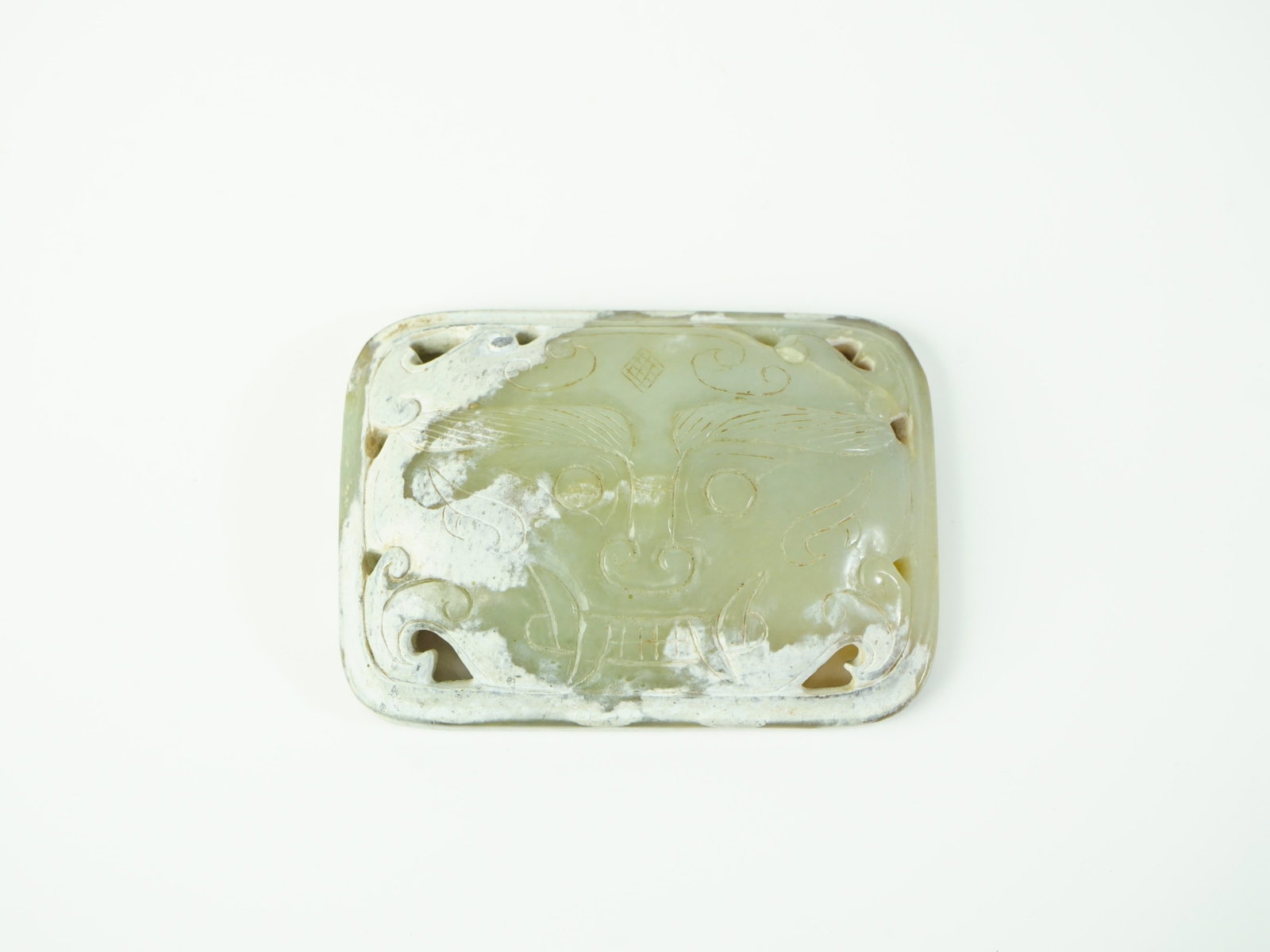 Chinese Carved Celadon Jade 'Taotie' Belt Buckle: Approximate size:2x2.25x0.75 in Shipping: We offer in-house shipping services for most small items. This means that we will take care of packing and shipping the items directly to you. For larger or