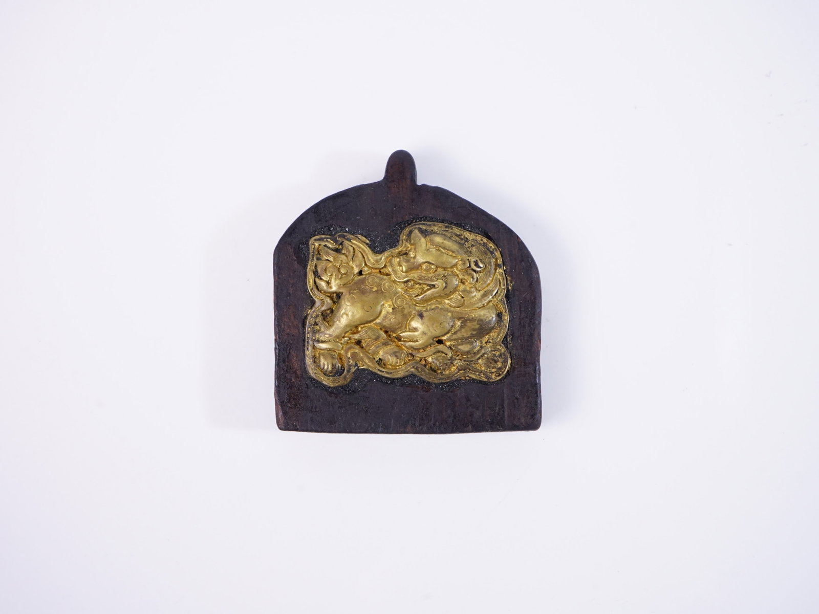 Tibetan Gilt Bronze Lion on Wood Plaque: Approximate size: 2.5x2.75x0.5 in Shipping: We offer in-house shipping services for most small items. This means that we will take care of packing and shipping the items directly to you. For larger or