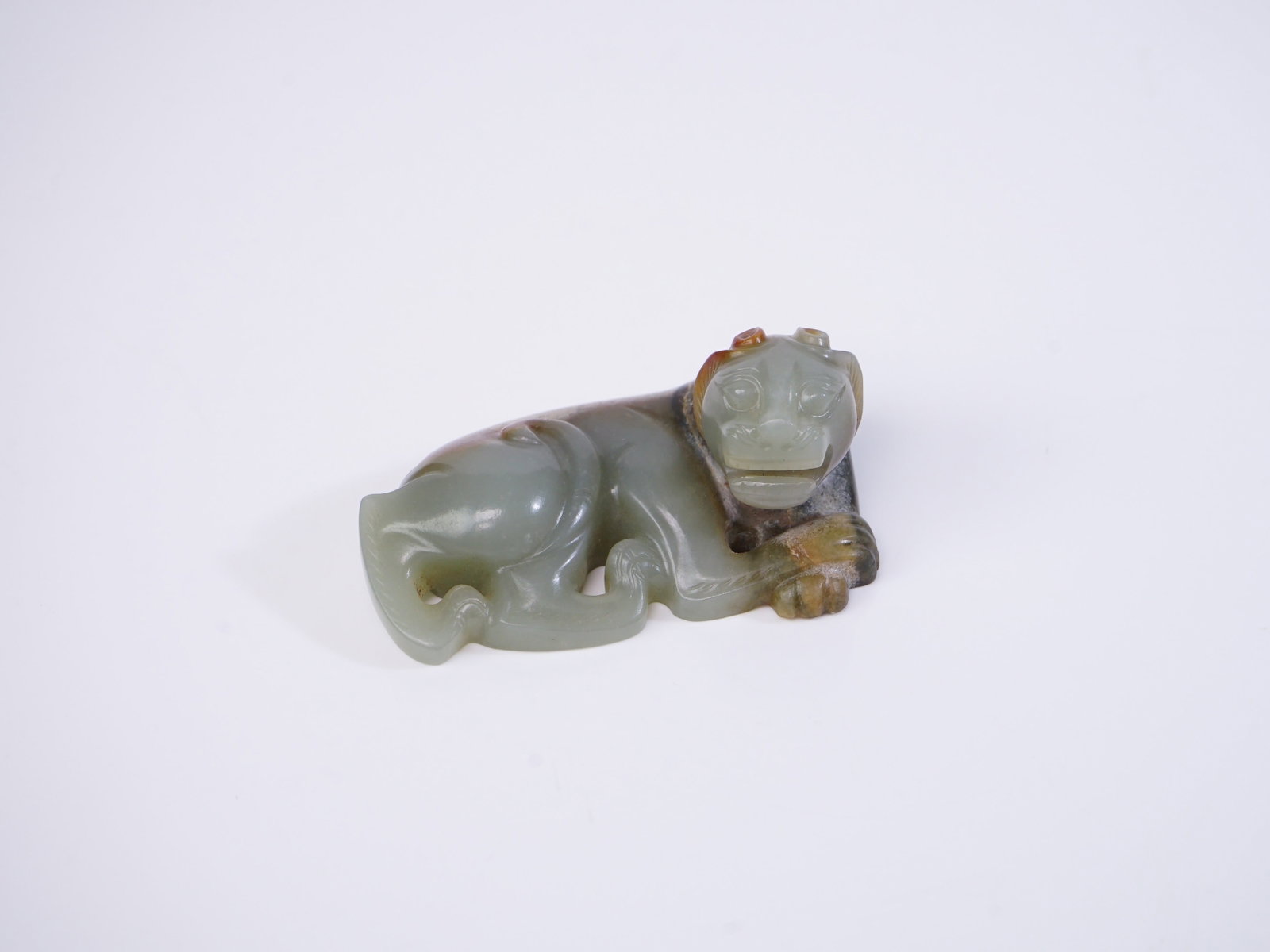 Chinese Carved Jade Tiger-Form Scholar's Paperweight: Approximate size: 3.25x1.25x2 in Shipping: We offer in-house shipping services for most small items. This means that we will take care of packing and shipping the items directly to you. For larger or