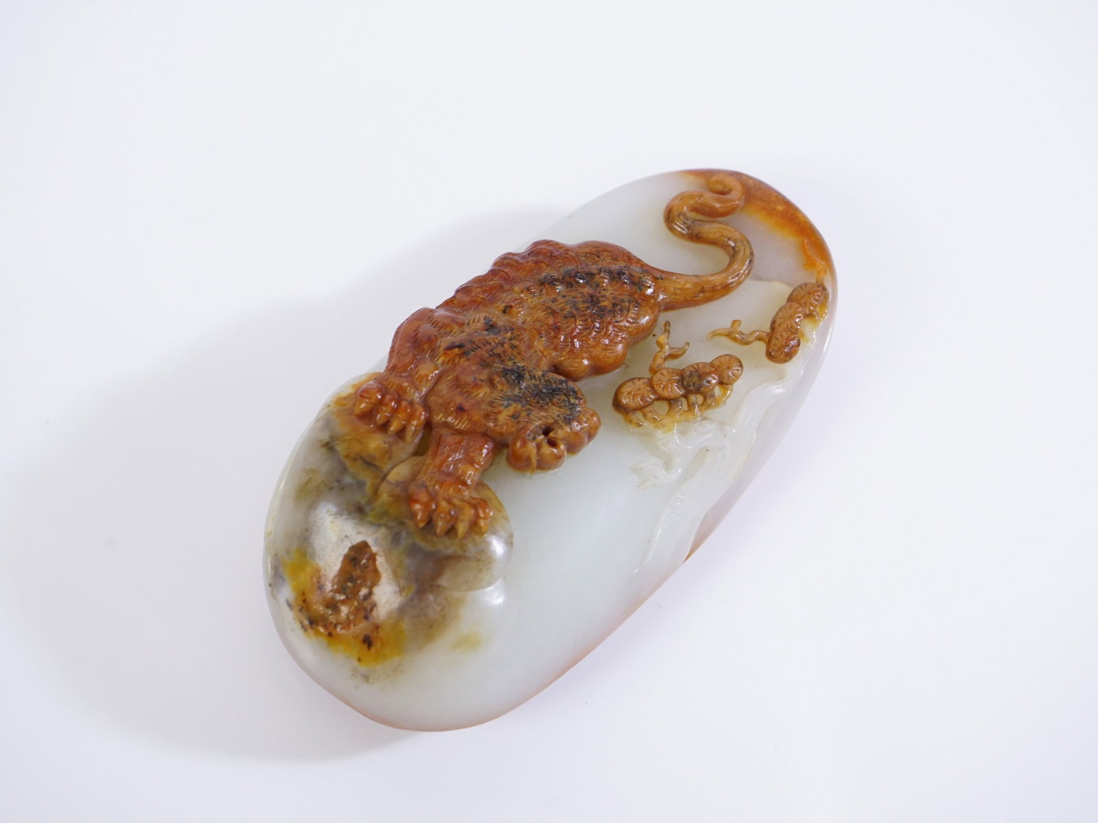 Chinese Carved Jade Pebble with Tiger Motif: Approximate size: 4x2x1.25 in Shipping: We offer in-house shipping services for most small items. This means that we will take care of packing and shipping the items directly to you. For larger or