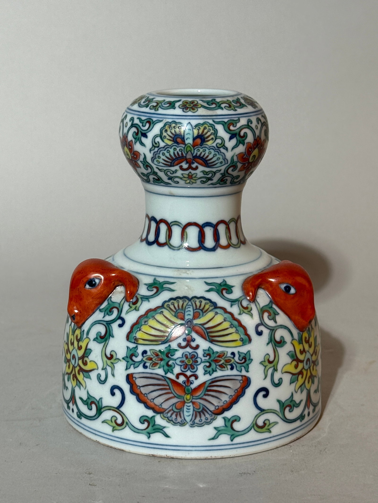 A Chinese Doucai 'Ram's-Head'-Handled Vase: 5.75"ht Shipping: We offer in-house shipping services for most small items. This means that we will take care of packing and shipping the items directly to you. For larger or specialized items, we rec
