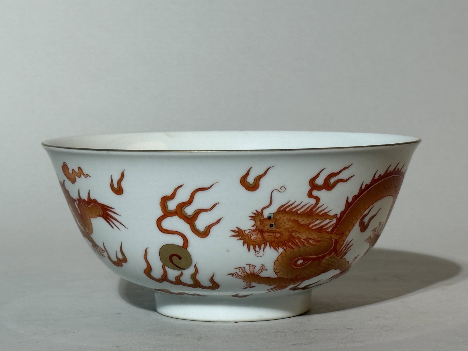 A Chinese Iron-Red 'Dragon' Bowl: 5.75"dia 2.5"ht Shipping: We offer in-house shipping services for most small items. This means that we will take care of packing and shipping the items directly to you. For larger or specialized items