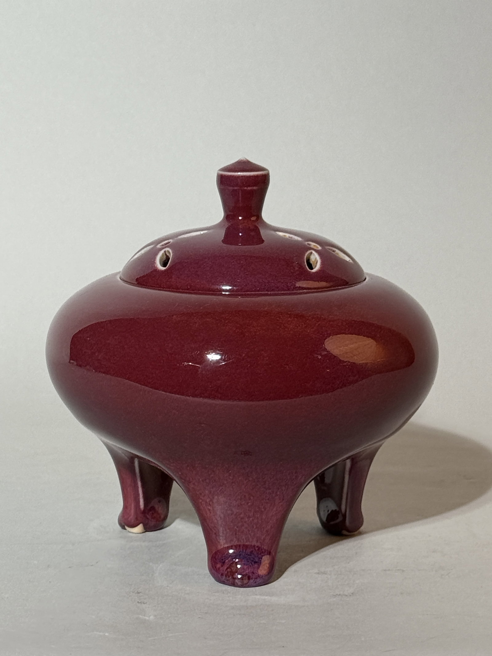 Japanese Oxblood Studio Porcelain Tripot Censer: 5"ht, signed, impressed seal under side of the cover Shipping: We offer in-house shipping services for most small items. This means that we will take care of packing and shipping the items directly to