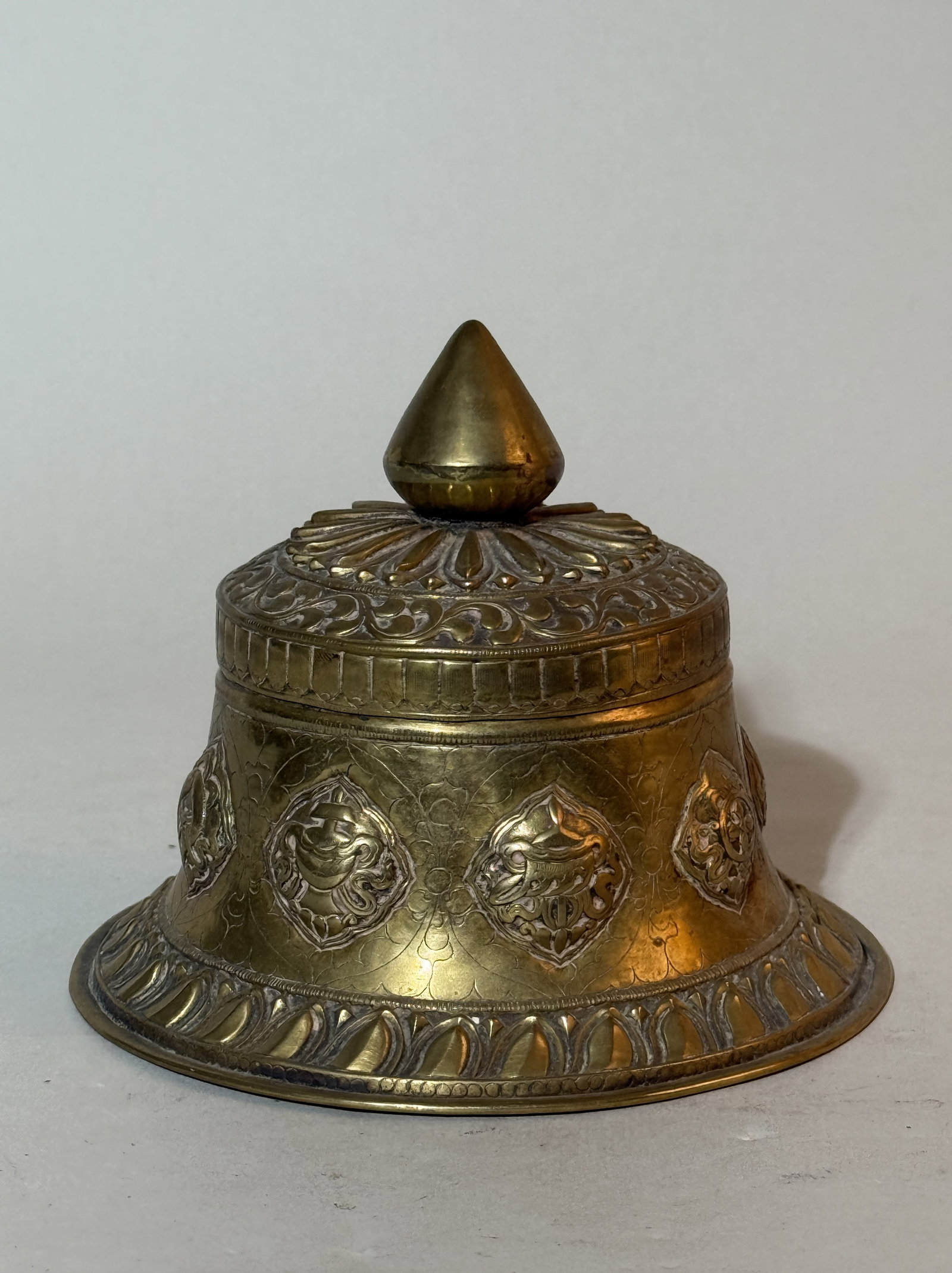 Tibetan Chased Copper Ceremonial Box: 5"dia 4.25"ht, with finely chased buddhist precious object motif Shipping: We offer in-house shipping services for most small items. This means that we will take care of packing and shipping the items