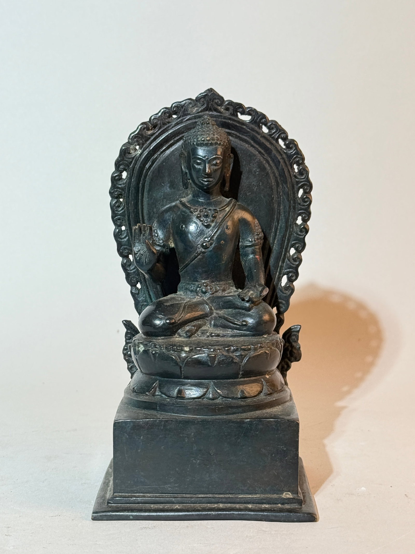 Tibetan Bronze Seated Figurine on Square Base: 8"ht Shipping: We offer in-house shipping services for most small items. This means that we will take care of packing and shipping the items directly to you. For larger or specialized items, we
