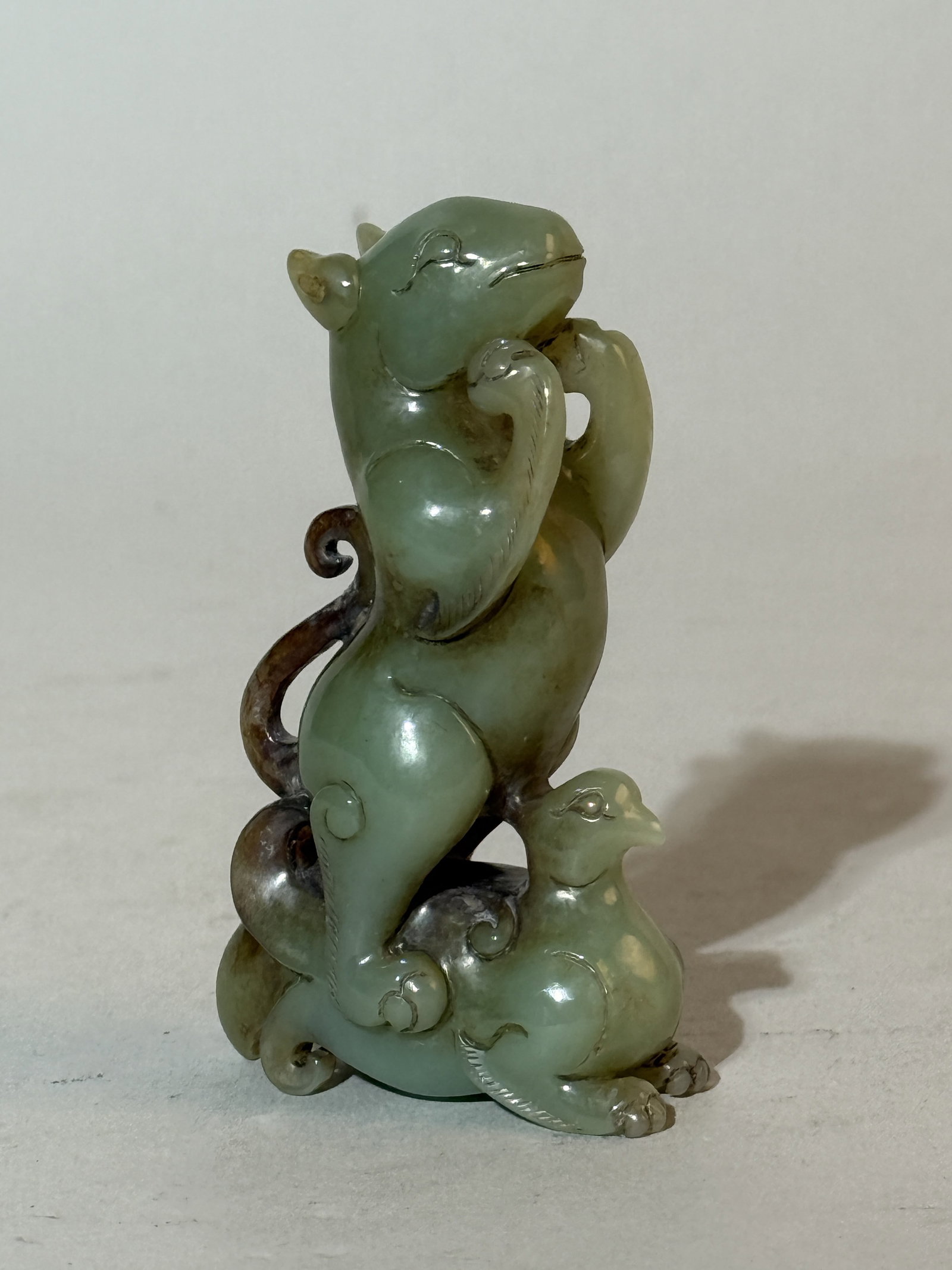 A Chinese Carved Celadon Jade 'Beast' Group: 3"ht Shipping: We offer in-house shipping services for most small items. This means that we will take care of packing and shipping the items directly to you. For larger or specialized items, we recomm