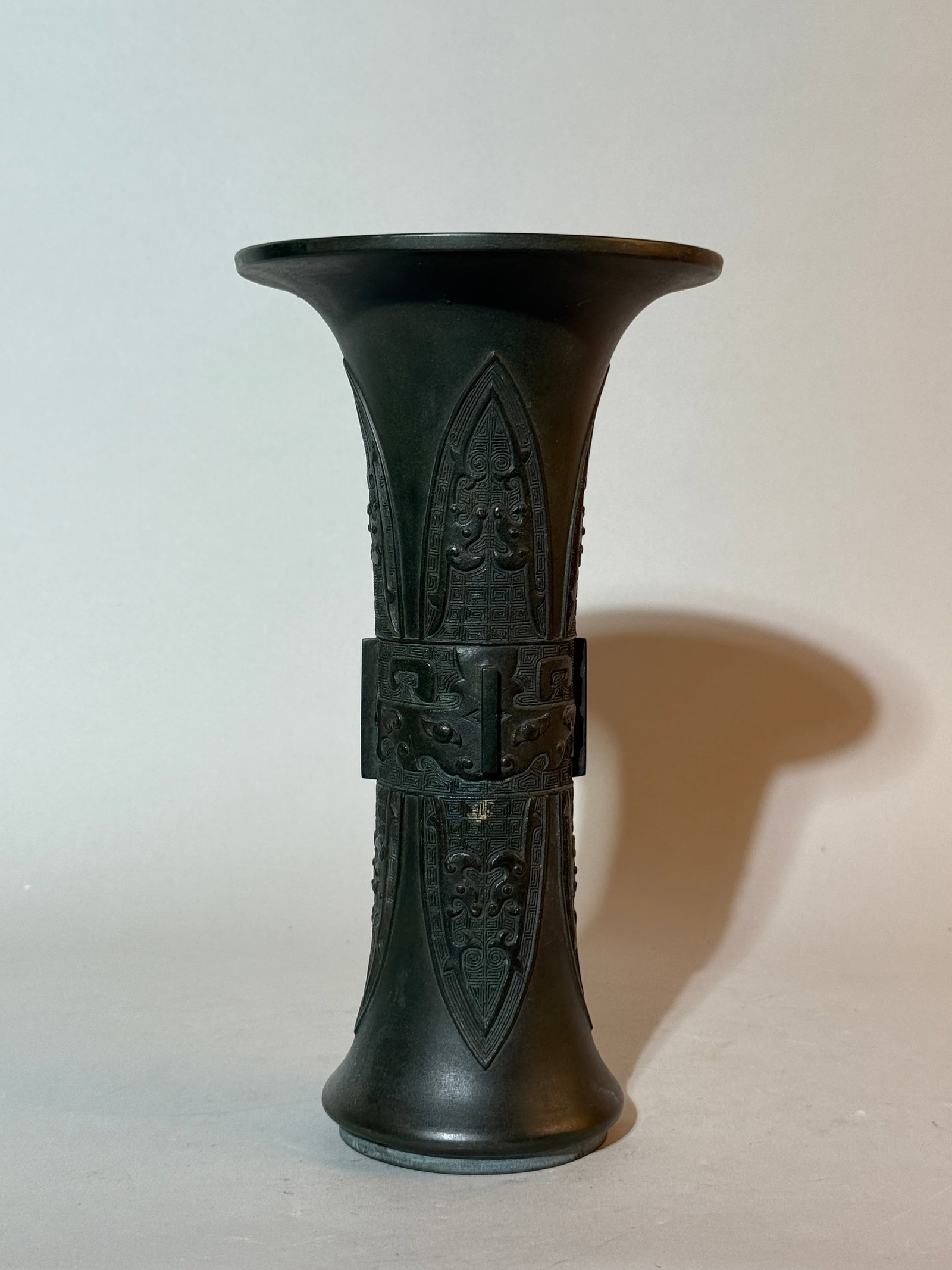 A Chinese Bronze Gu-Form Vase: 10"ht Shipping: We offer in-house shipping services for most small items. This means that we will take care of packing and shipping the items directly to you. For larger or specialized items, we recom