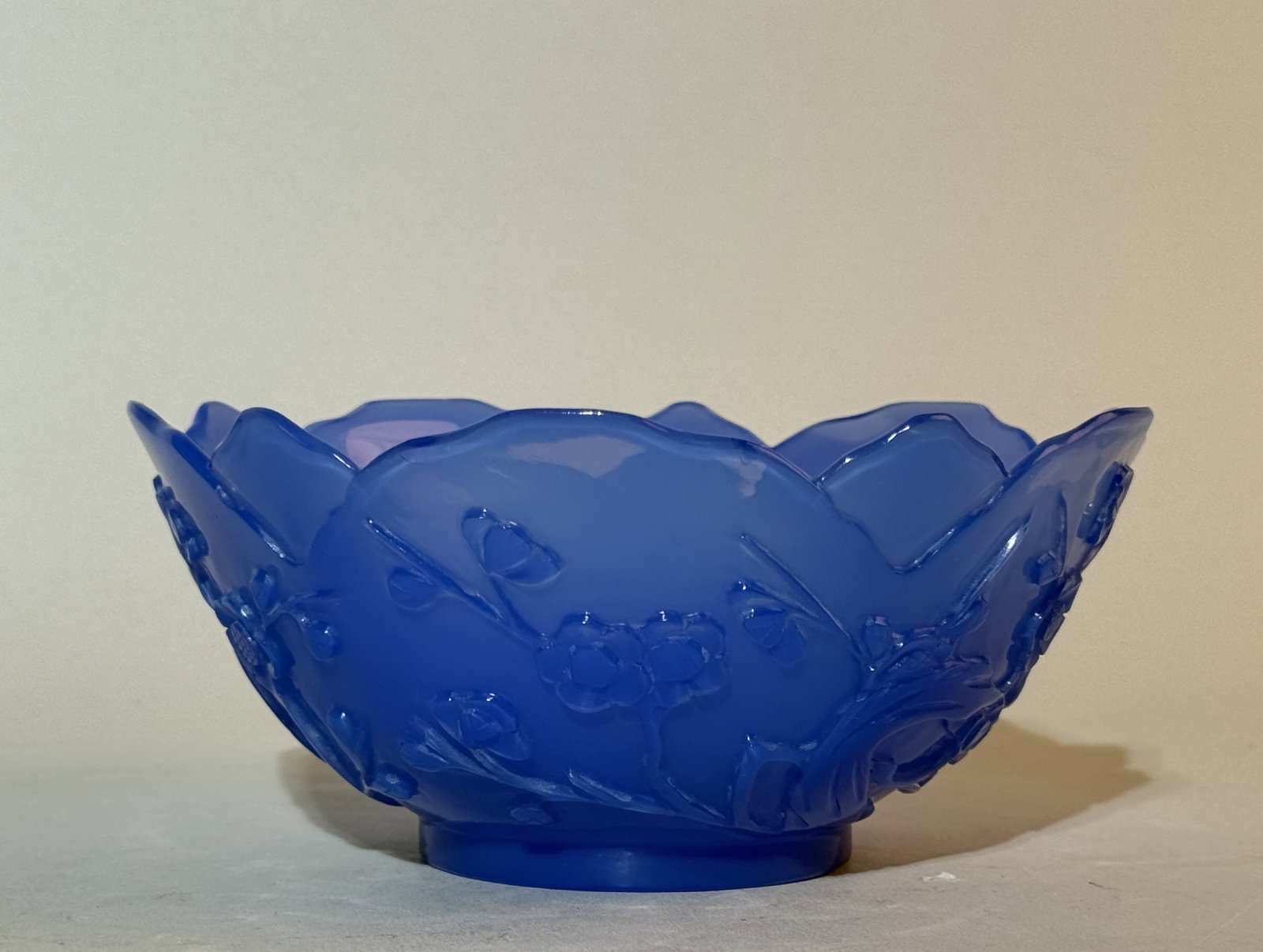 Pair of Chinese Carved Blue Peking Glass Bowls: 6"dia, plum blossom motif Shipping: We offer in-house shipping services for most small items. This means that we will take care of packing and shipping the items directly to you. For larger or special