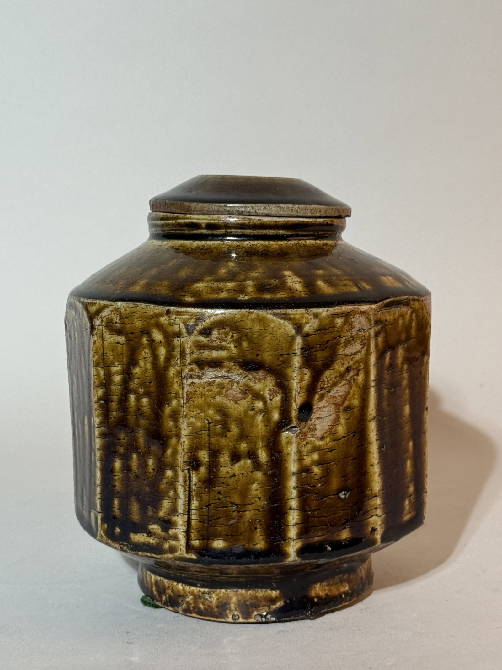 A Korean Faceted Porcelain Jar and Cover: 7"ht, with straw brown glaze Shipping: We offer in-house shipping services for most small items. This means that we will take care of packing and shipping the items directly to you. For larger or spec