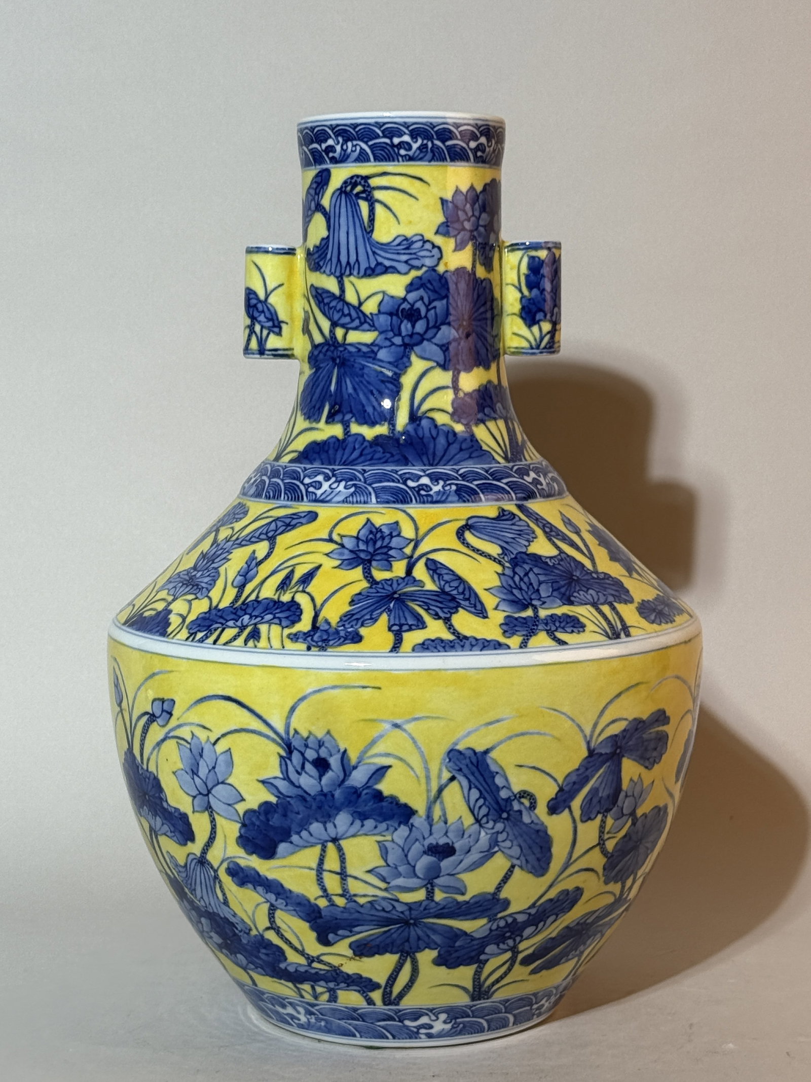 A Chinese Yellow-Ground Underglaze-Blue 'Lotus' Arrow Vase: 14.25"ht Shipping: We offer in-house shipping services for most small items. This means that we will take care of packing and shipping the items directly to you. For larger or specialized items, we