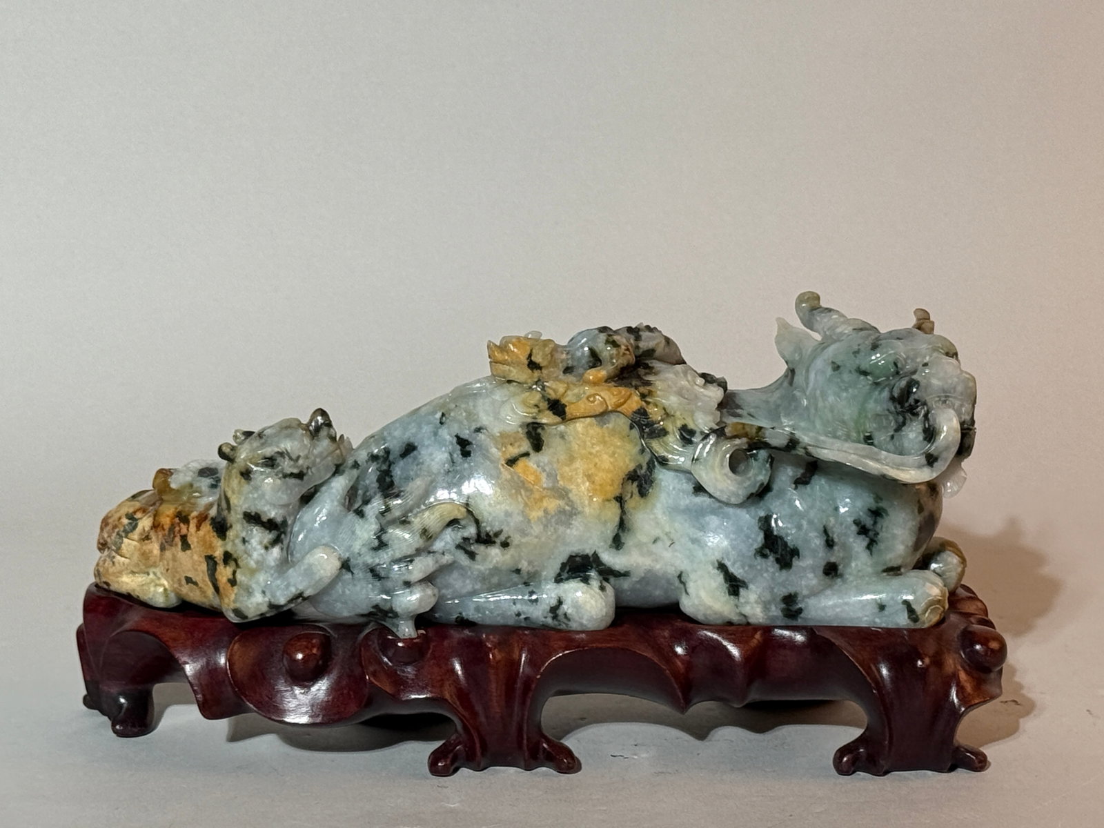 A Chinese Carved Jadeite 'Qilin' Group: 10"L Shipping: We offer in-house shipping services for most small items. This means that we will take care of packing and shipping the items directly to you. For larger or specialized items, we