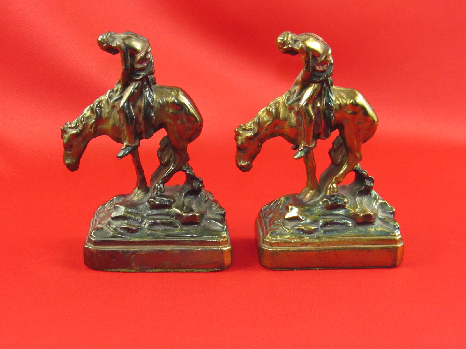 Vintage Native American Indian On Horseback Metal Bookends: Nice set of vintage Native American Indian on horseback metal bookends. Overall very good condition (see photos). Approximately 6 1/2" tall. These come from an old estate in Wisconsin.