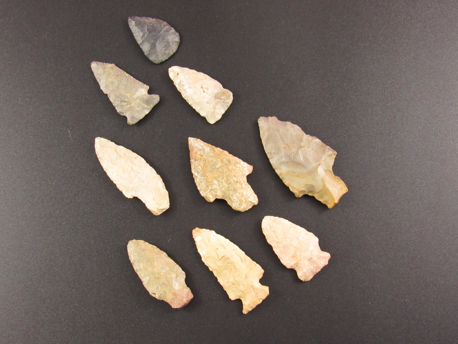 Nine Prehistoric Native American Indian Flint Arrowheads: Nine prehistoric Indian flint arrowheads from an old estate in Indiana. Good Mixture of styles and materials. See photos for additional detail.