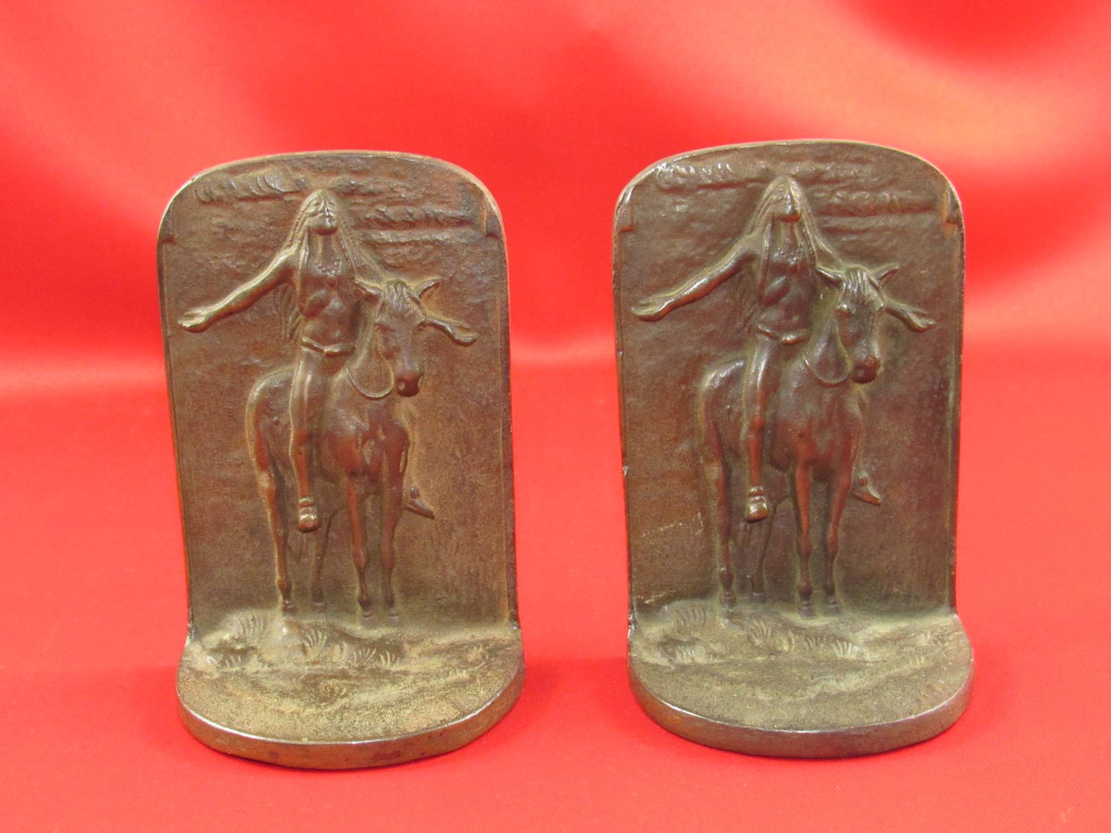 Vintage Metal Native American Bookends: Very nice vintage Native American metal bookends. Appearance is good with normal use wear present (see photos for additional detail). Very decorative and well-made examples. Approximately 5 1/2" tall.