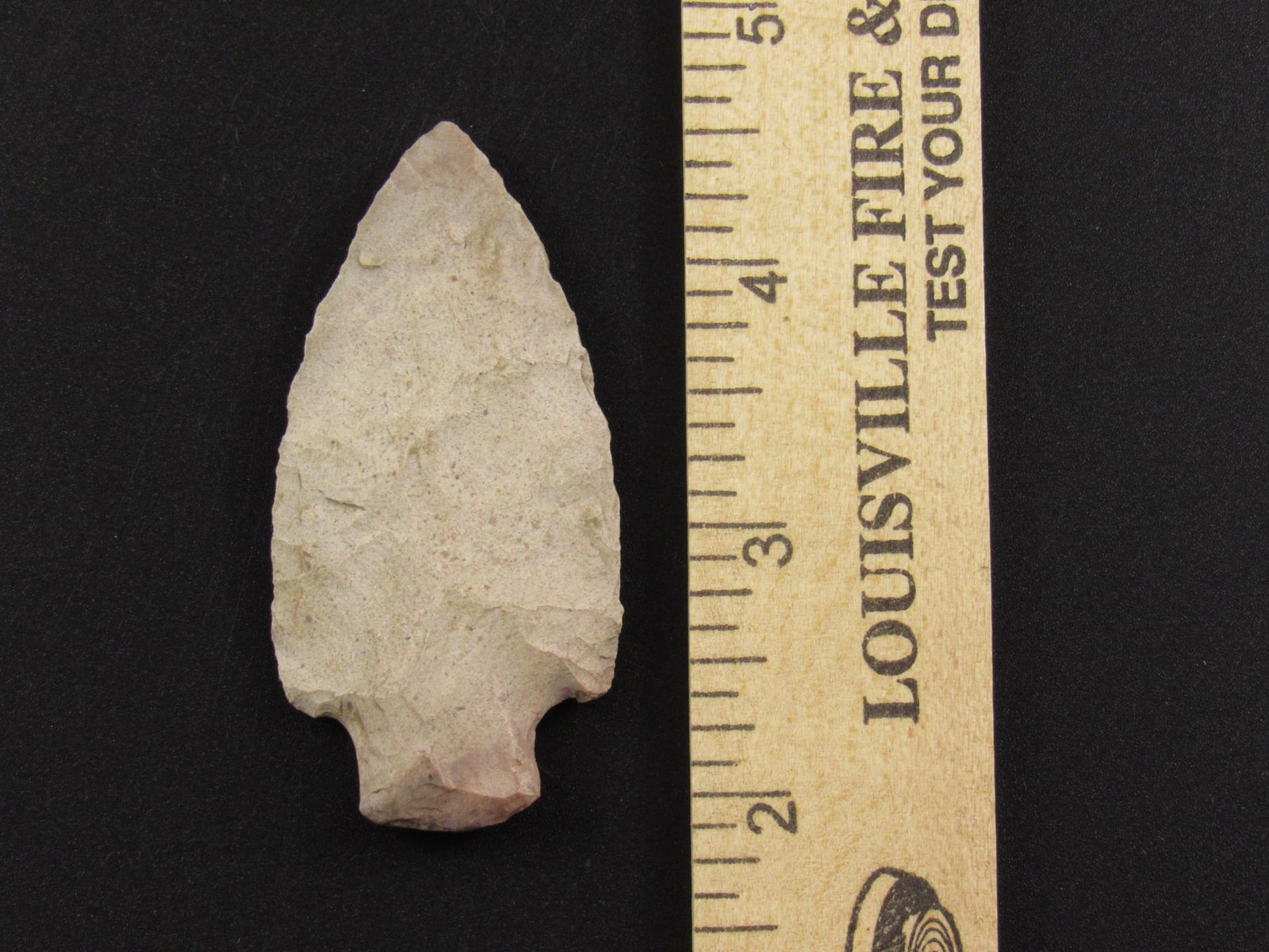 Native American Indian Flint Arrowhead: Very nice Indian flint arrowhead. Writing on one side states "Ark 1926". Modern edge rework. Ex Ted Kouba family collection.
