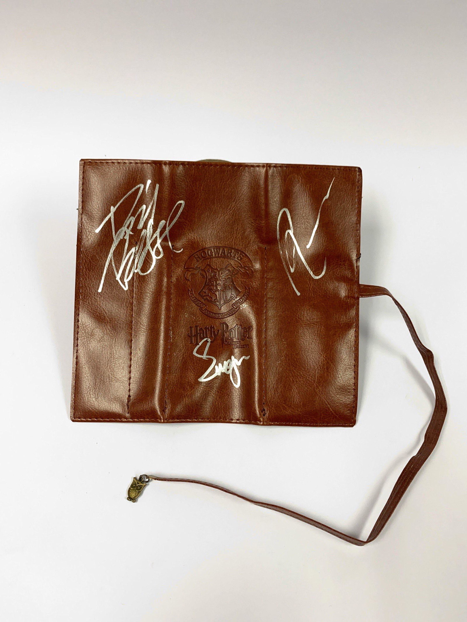 Autograph Signed Harry Potter Main Cast Pouch: Autographed by:Daniel Radcliffe, Emma Watson, Rupert GrintExcellent Condition and Certified