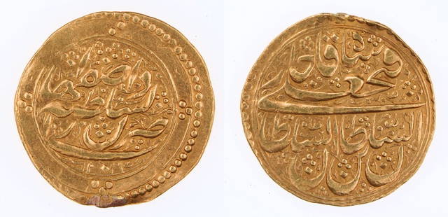 Persian (Toman) Gold Coin Fath Ali Shah 1212 to 1250 AH: Persian coin from pure gold made between 1797 and 1834 AD (1212 to 1250 AH), during the reign of Shah Fath Ali.It is 5,06 grams, and in very good condition.