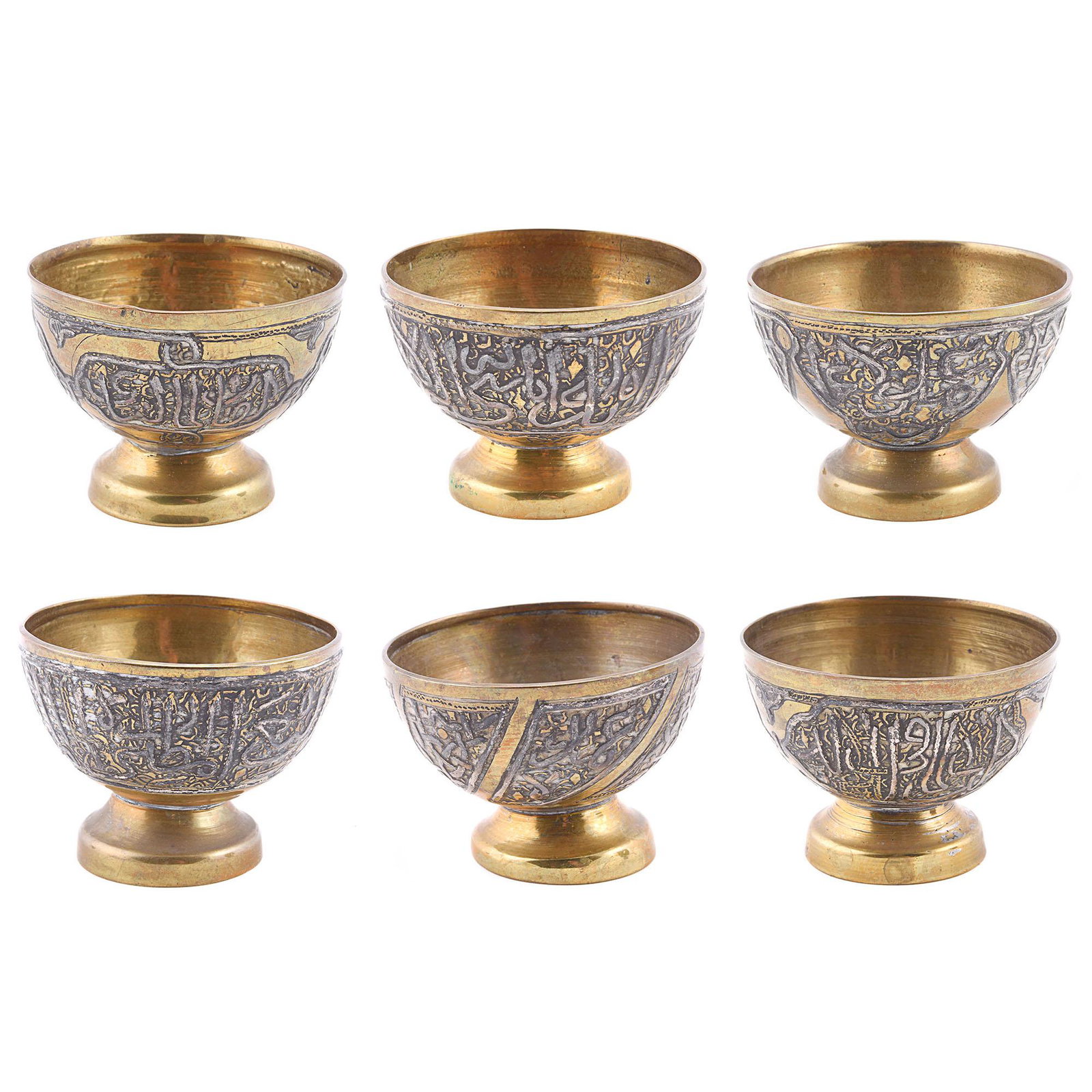 A set of 6 zarfs (coffee cup holders) (Syria): A set of 6 early 20th century zarfs (coffee cup holders) made out of brass and decorated with calligraphy and silver inlay. Syria. Approx. H: 4cm Dia.: 5.5cm each 